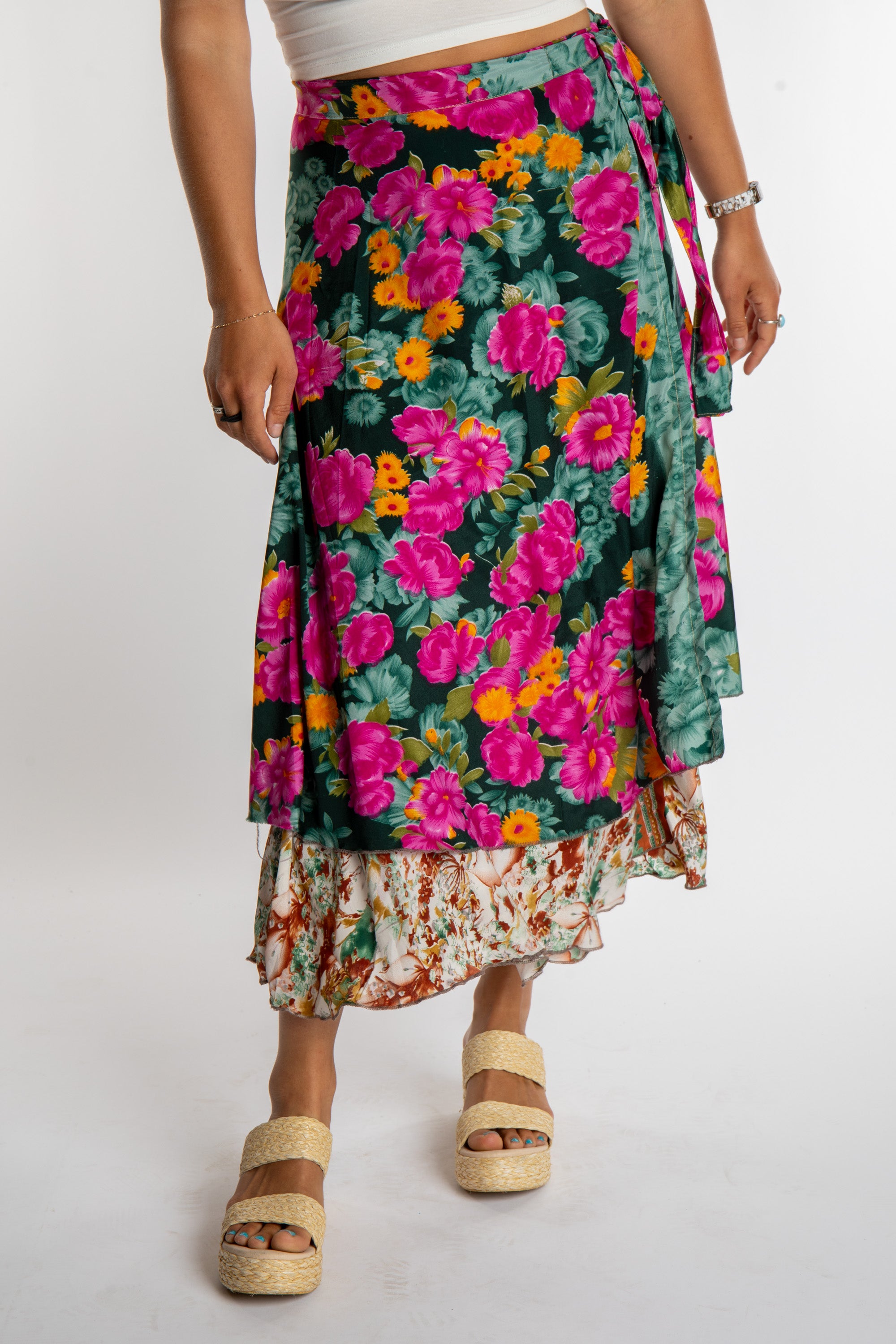 Sophie is wearing a long reversible silk wrap skirt in morning dew