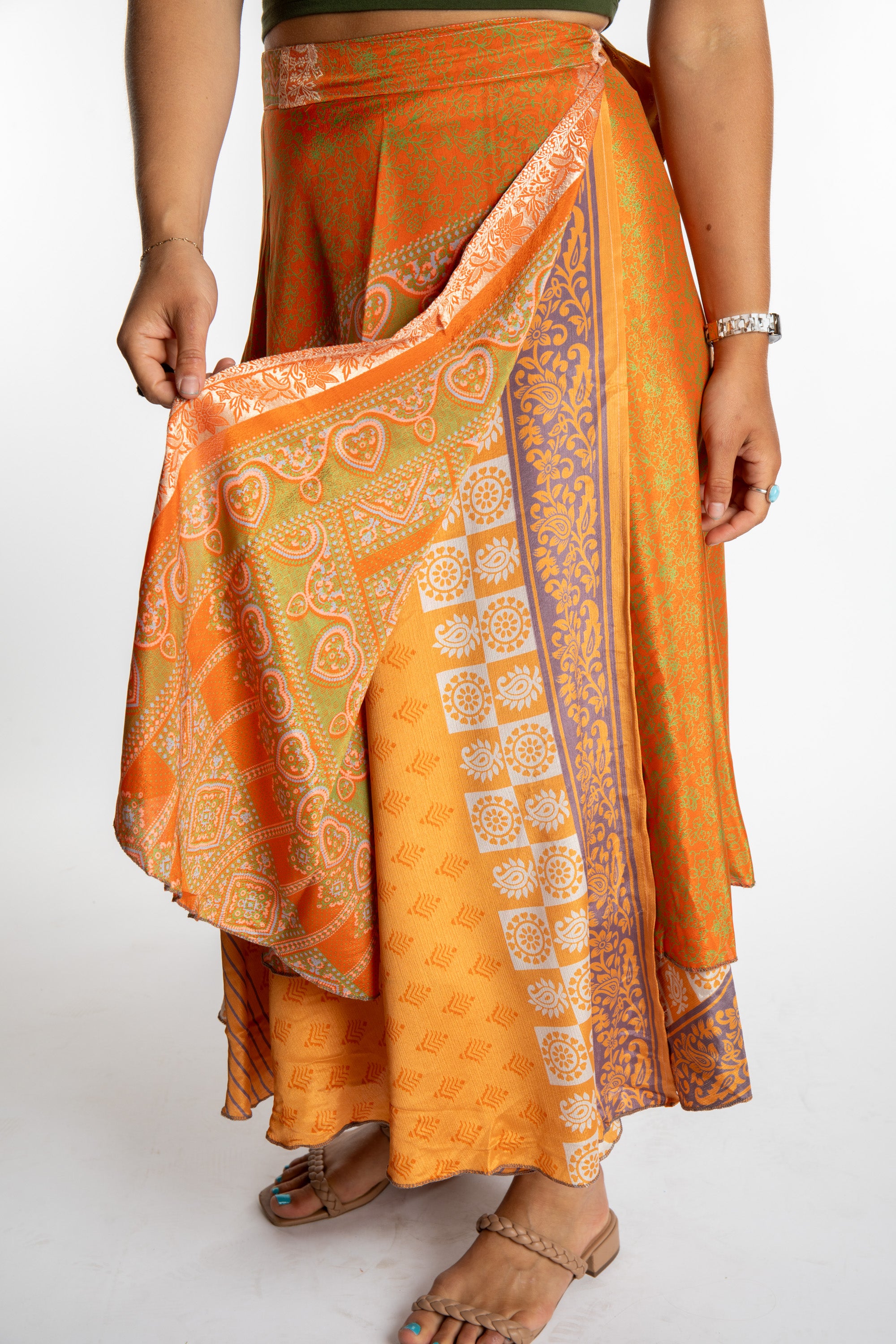 Sophie is wearing a long reversible silk wrap skirt in fire on the mountain