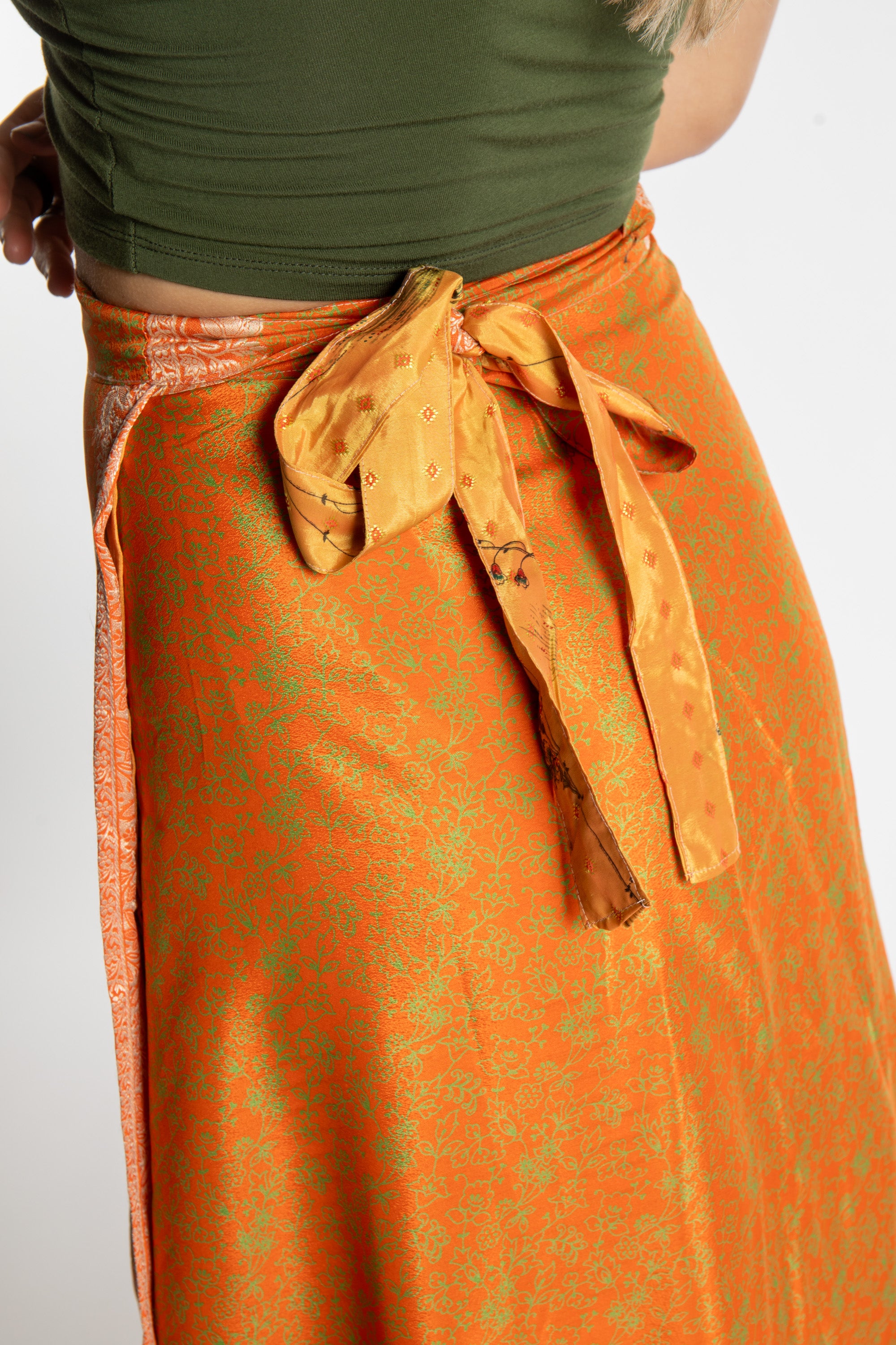 Sophie is wearing a long reversible silk wrap skirt in fire on the mountain