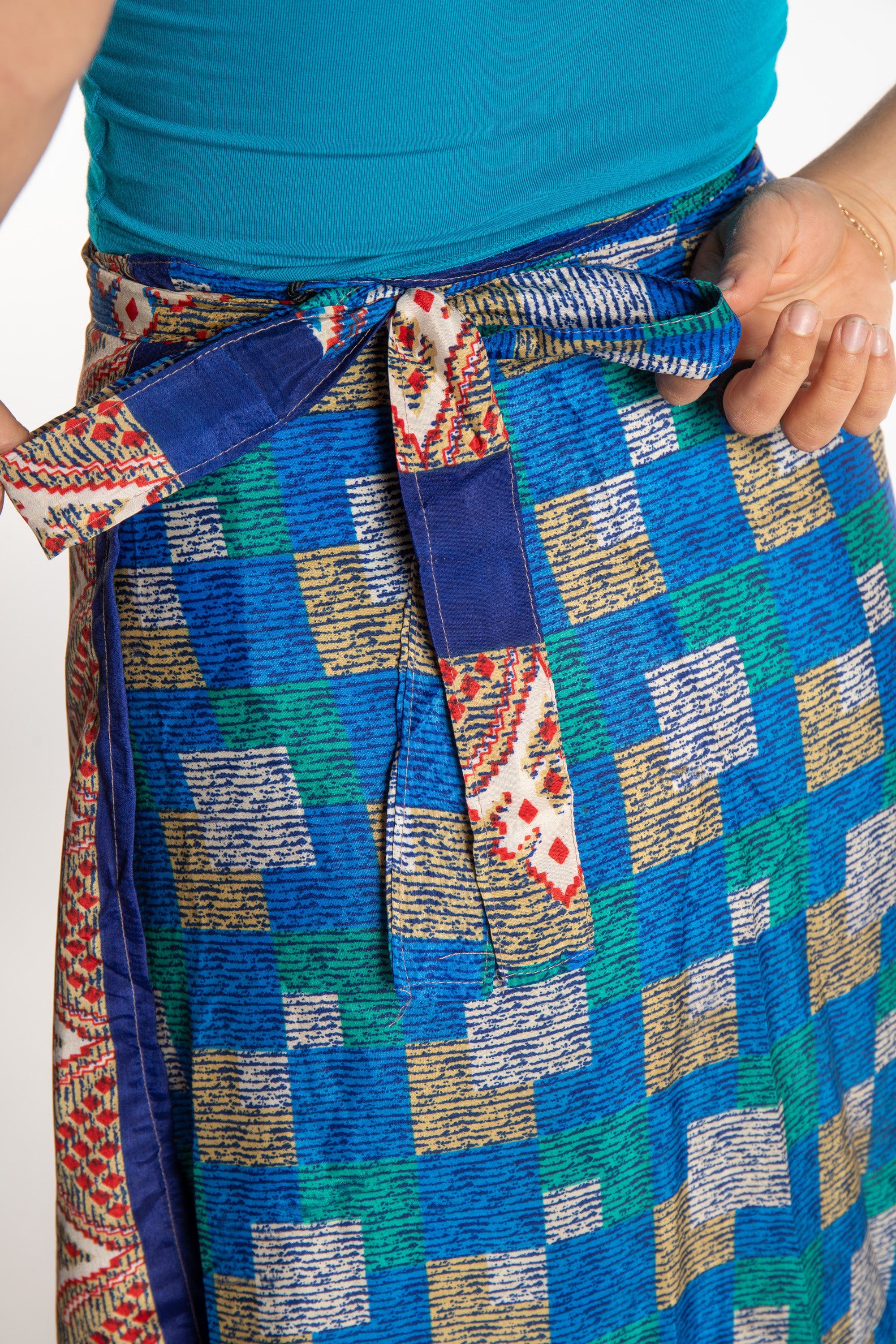 Sophie is wearing a long reversible silk wrap skirt in morning dew