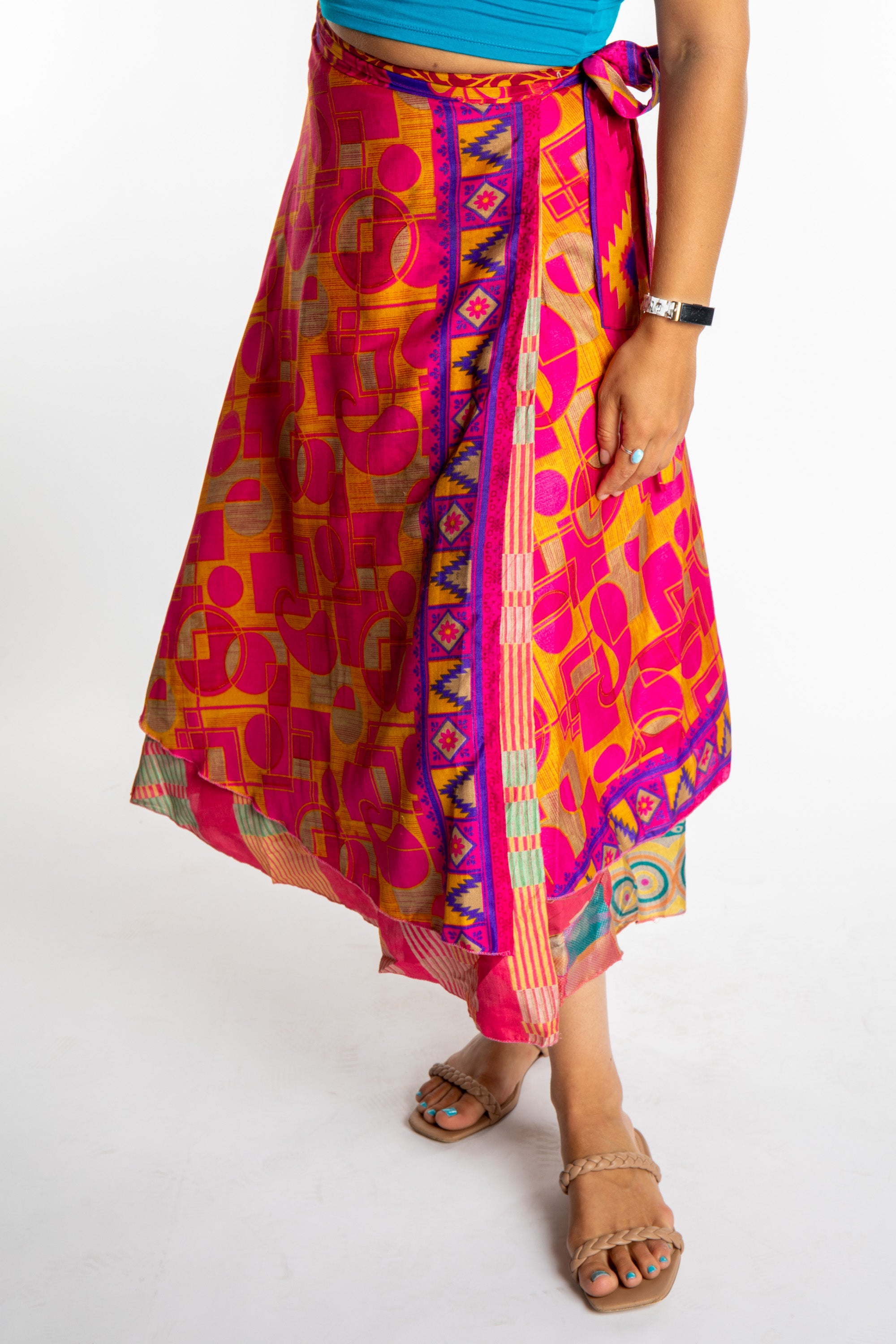 Sophie is wearing a long reversible silk wrap skirt in sugar magnolia