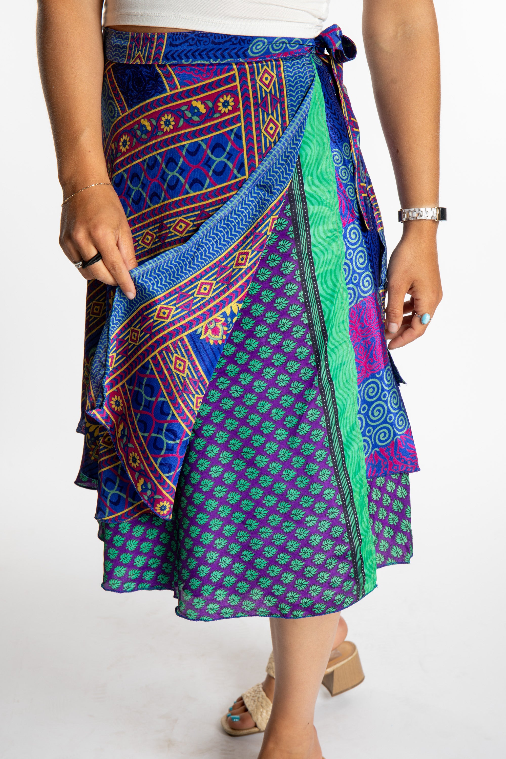 Sophie is wearing a midi reversible silk wrap skirt in dark star