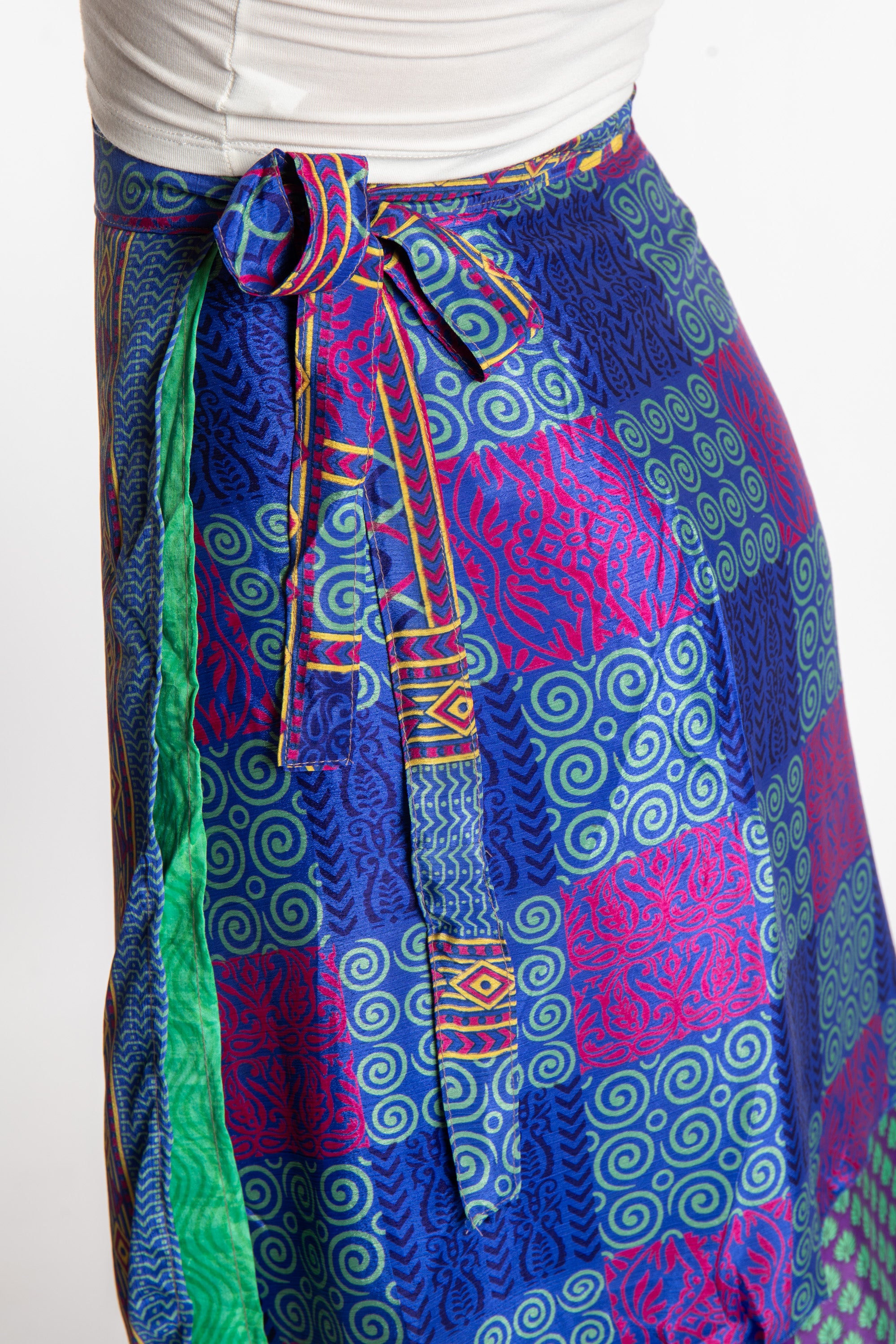 Sophie is wearing a midi reversible silk wrap skirt in dark star