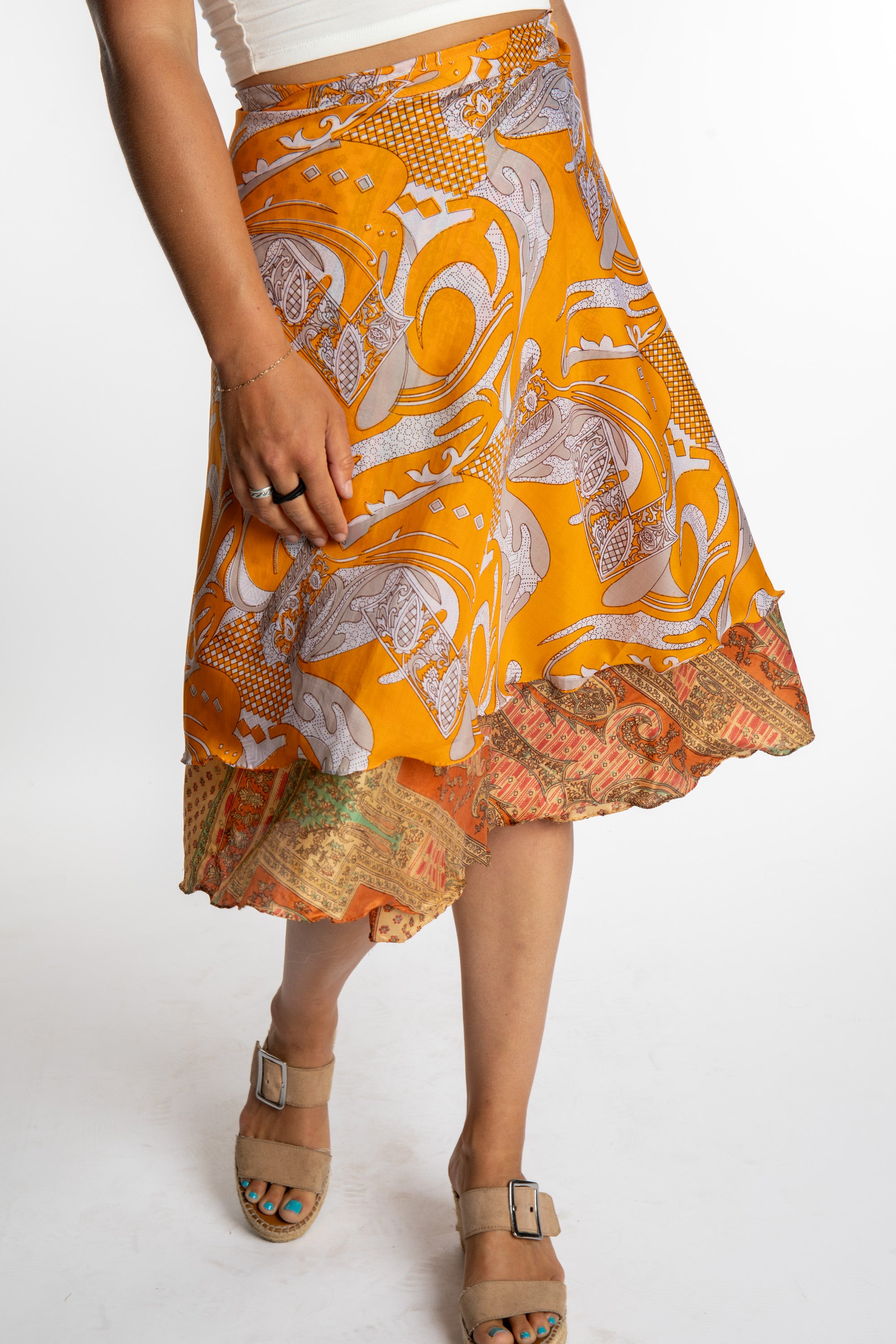 Sophie is wearing a midi reversible silk wrap skirt in fire on the mountain