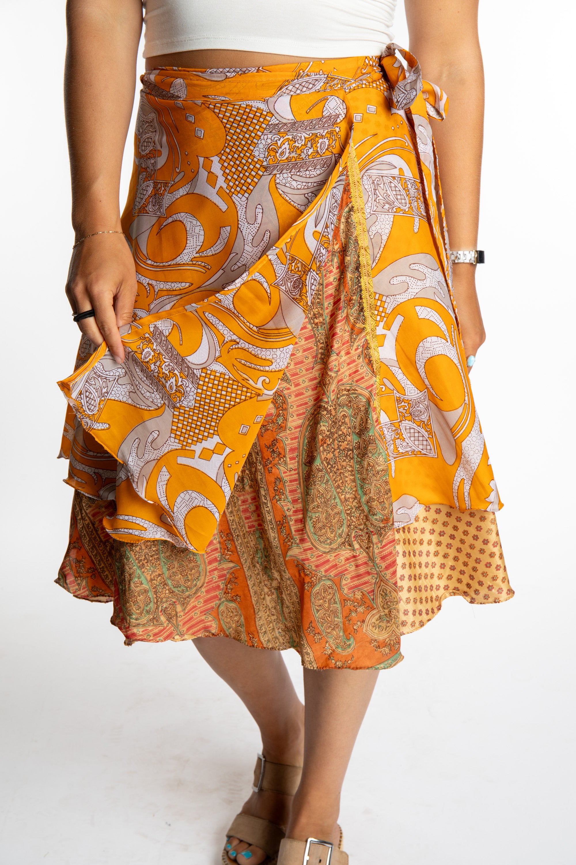 Sophie is wearing a midi reversible silk wrap skirt in fire on the mountain