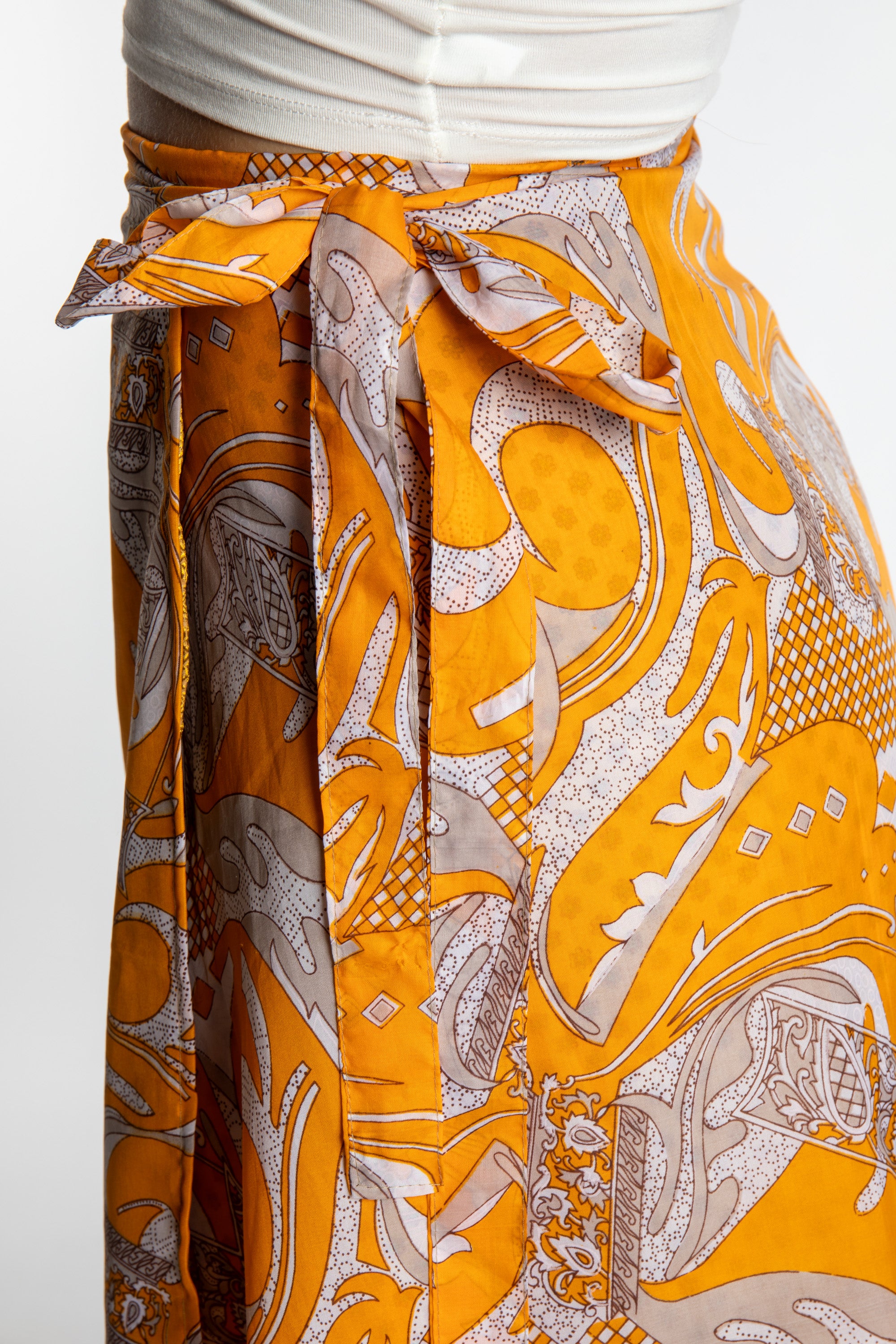 Sophie is wearing a midi reversible silk wrap skirt in fire on the mountain