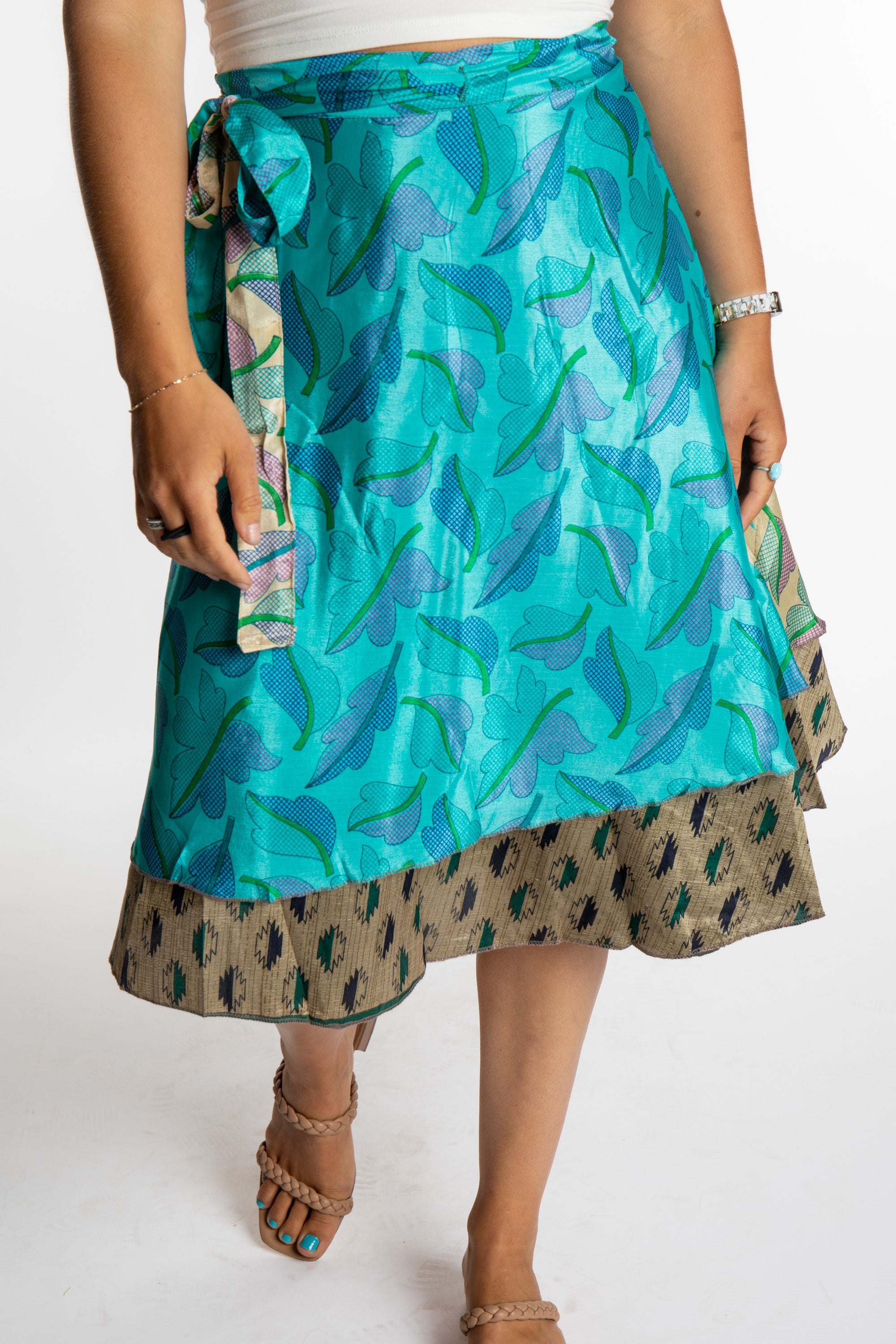 Sophie is wearing a midi reversible silk wrap skirt in morning dew