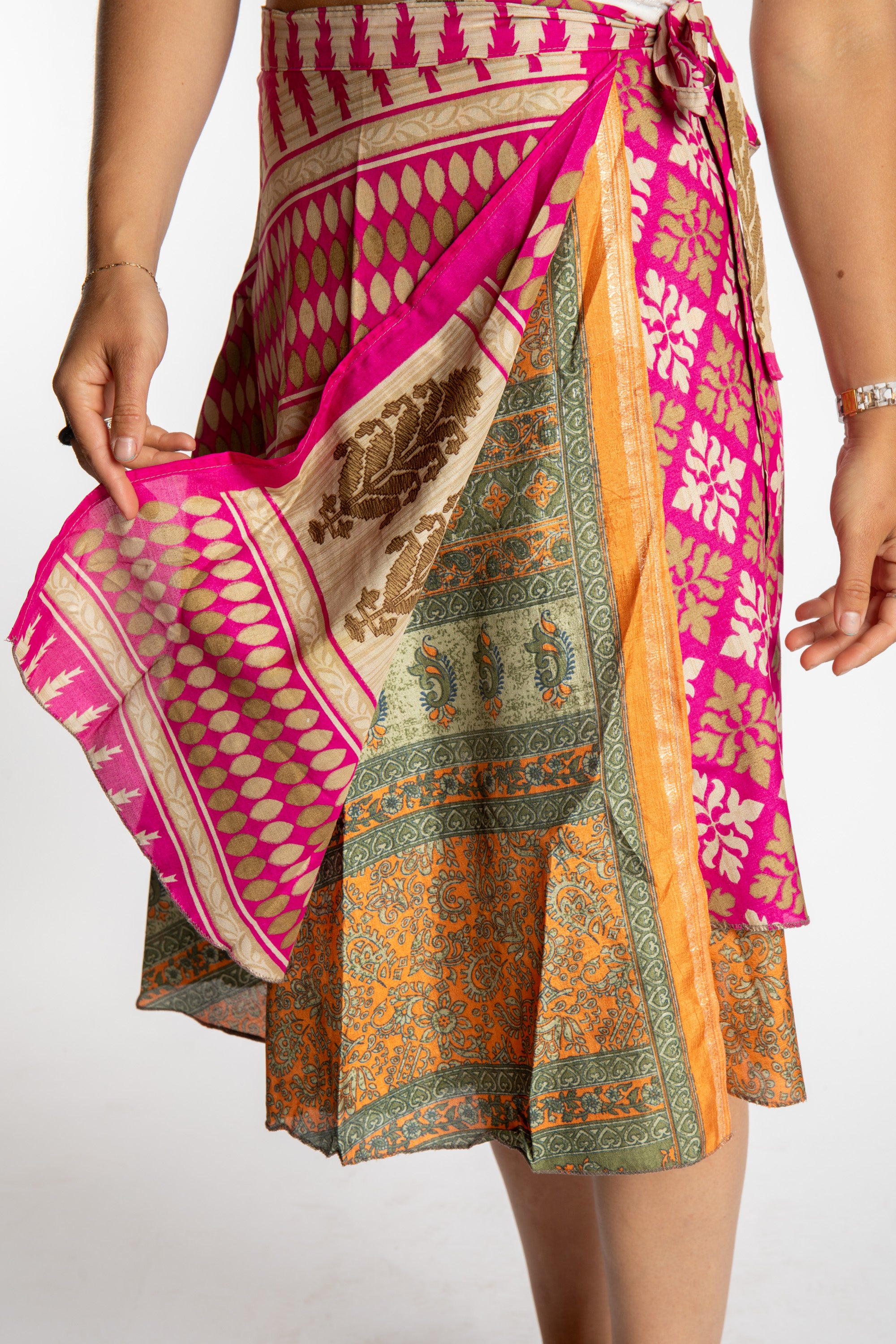Sophie is wearing a midi reversible silk wrap skirt in sugar magnolia