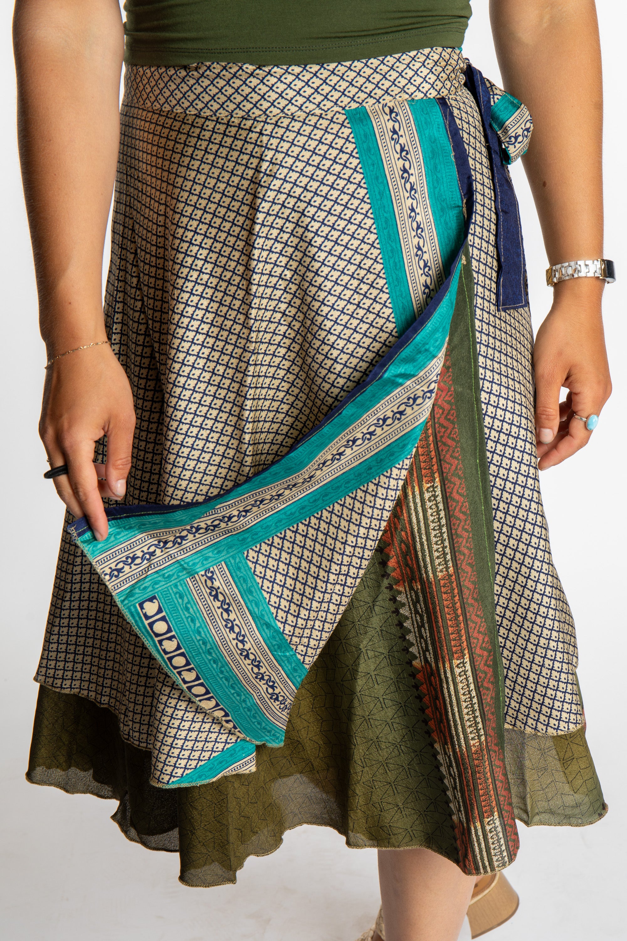 Sophie is wearing a midi reversible silk wrap skirt in shakedown street