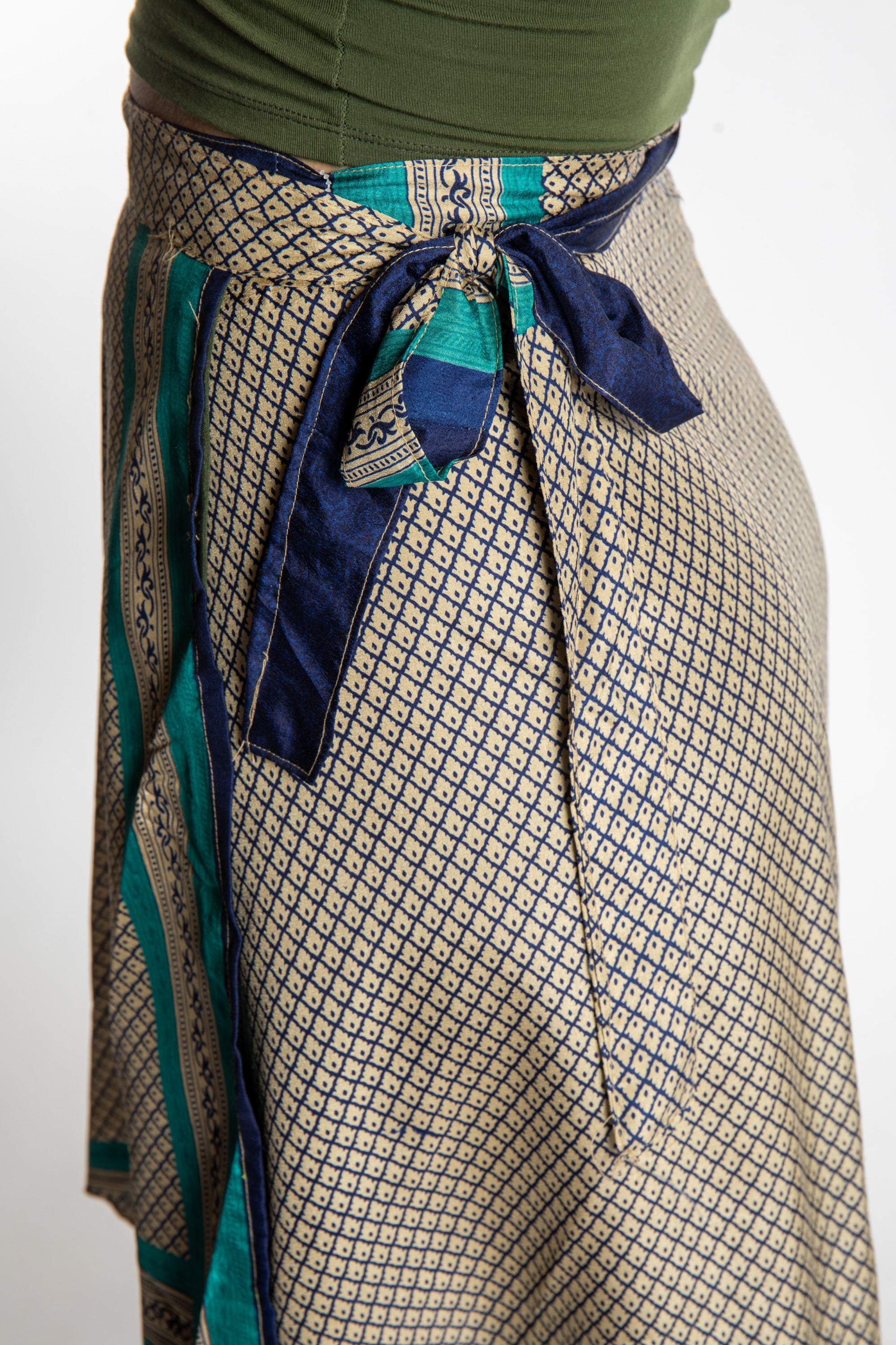 Sophie is wearing a midi reversible silk wrap skirt in shakedown street