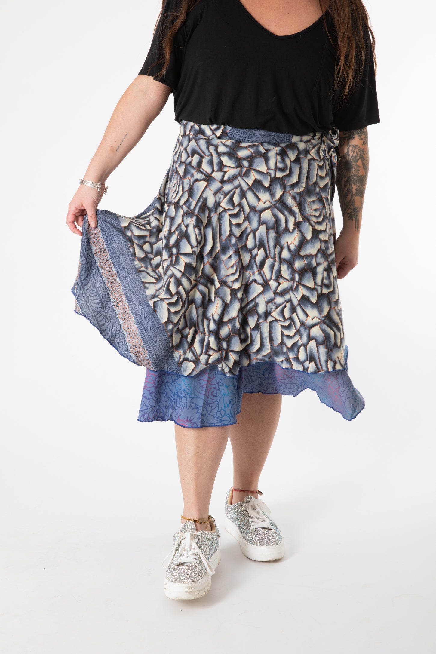Desiree is wearing a silk wrap skirt in shakedown street