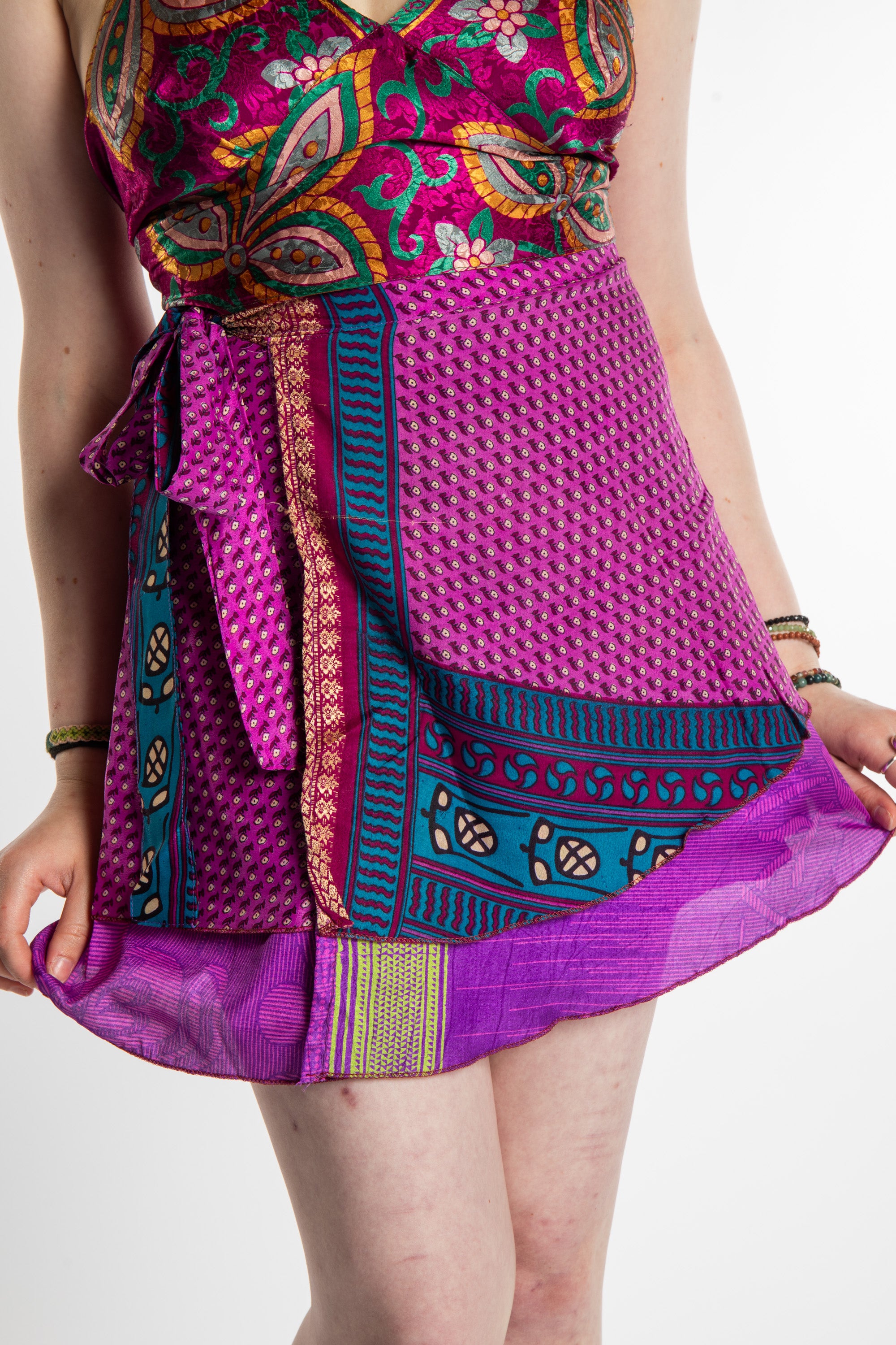 Honora is wearing a silk wrap skirt in Dark Star