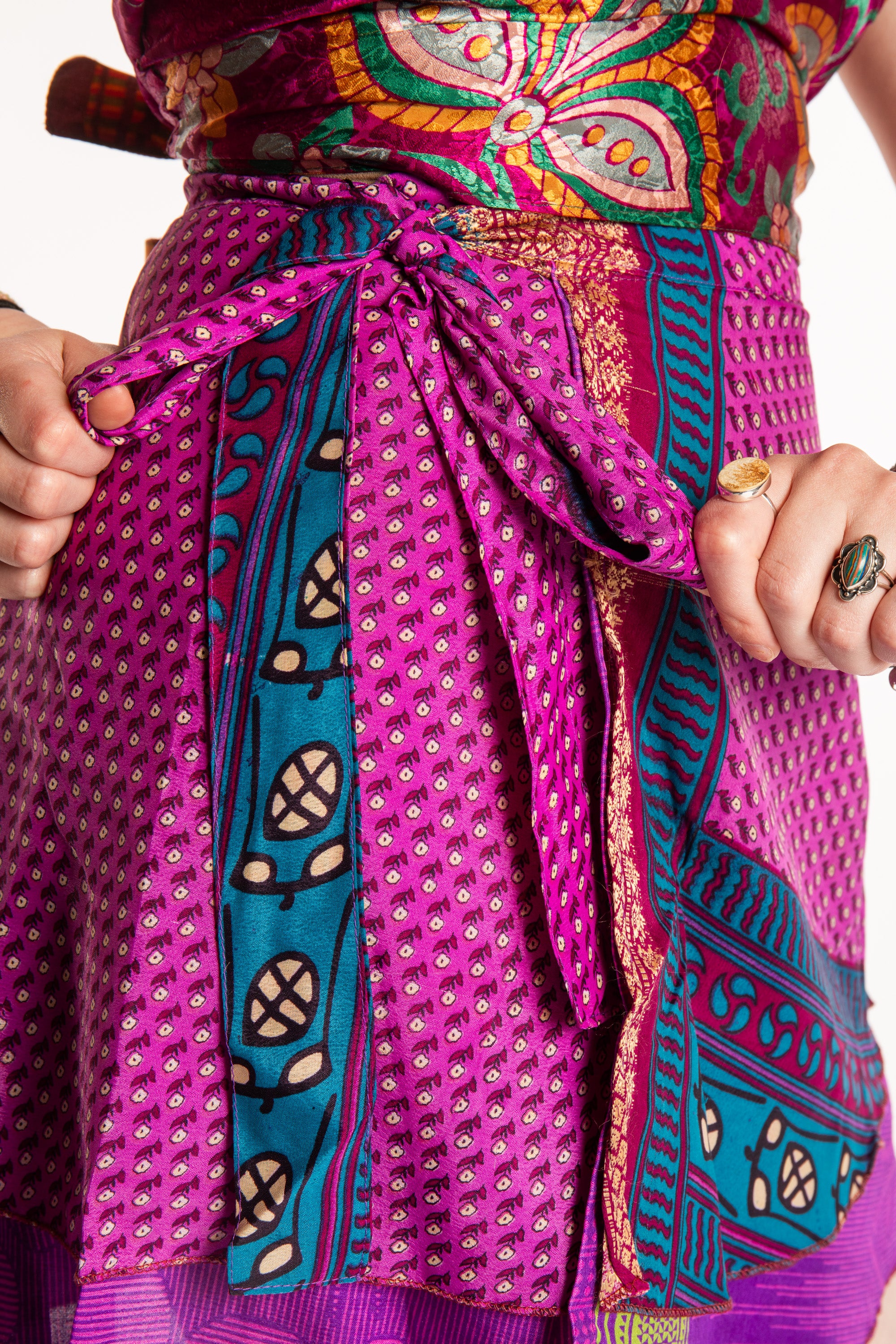 Honora is wearing a silk wrap skirt in Dark Star