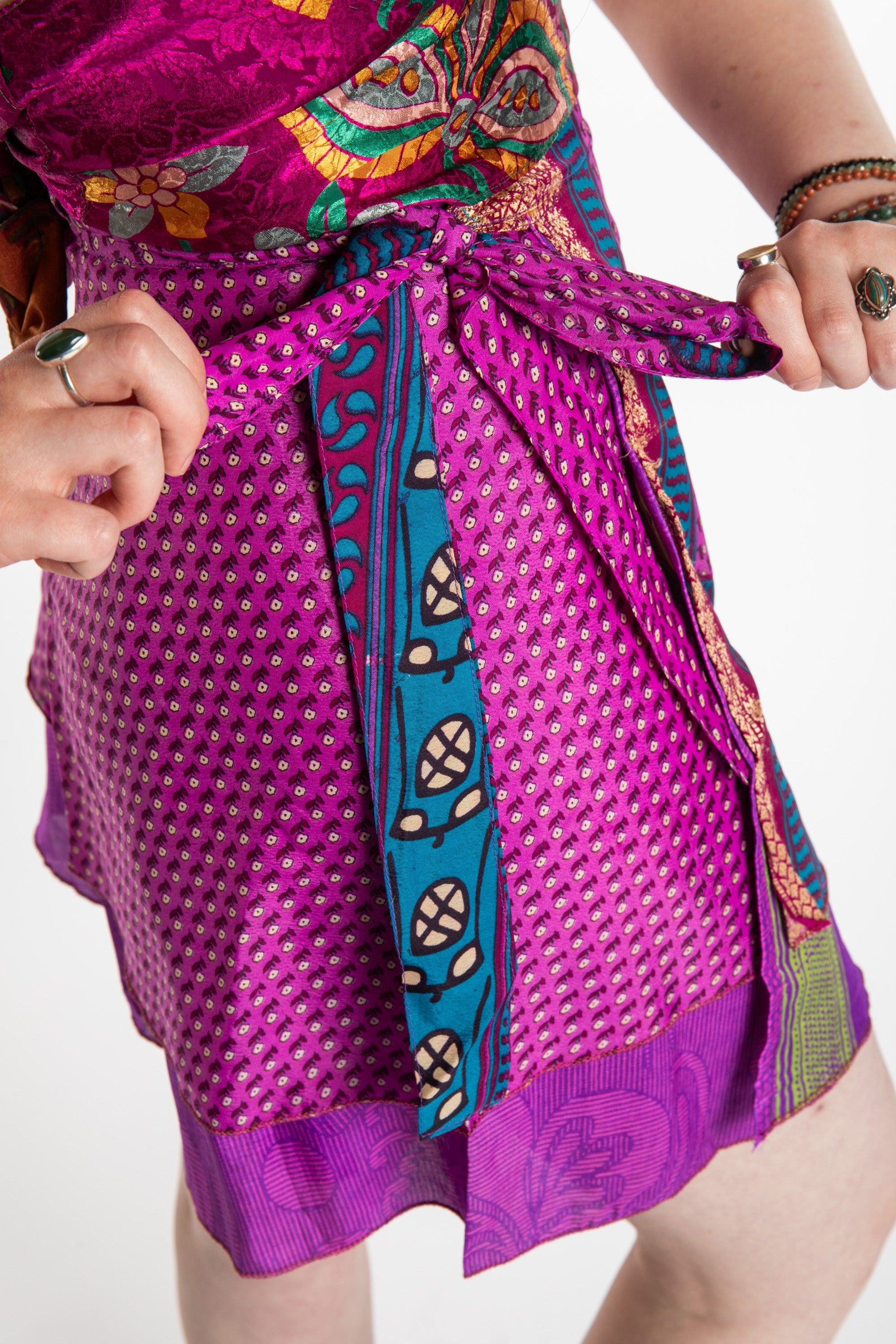 Honora is wearing a silk wrap skirt in Dark Star