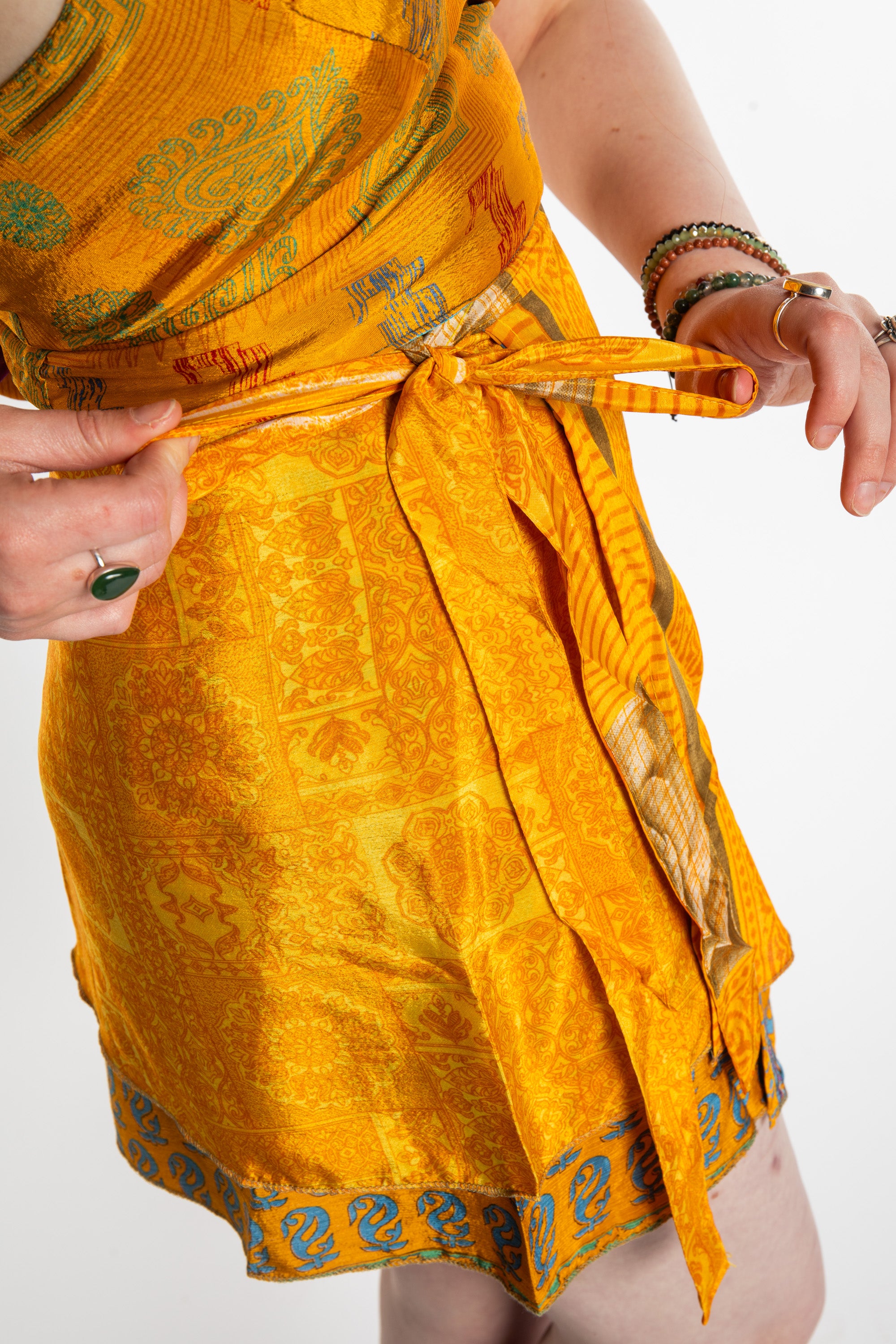 Honora is wearing a silk wrap skirt in Fire on the Mountain