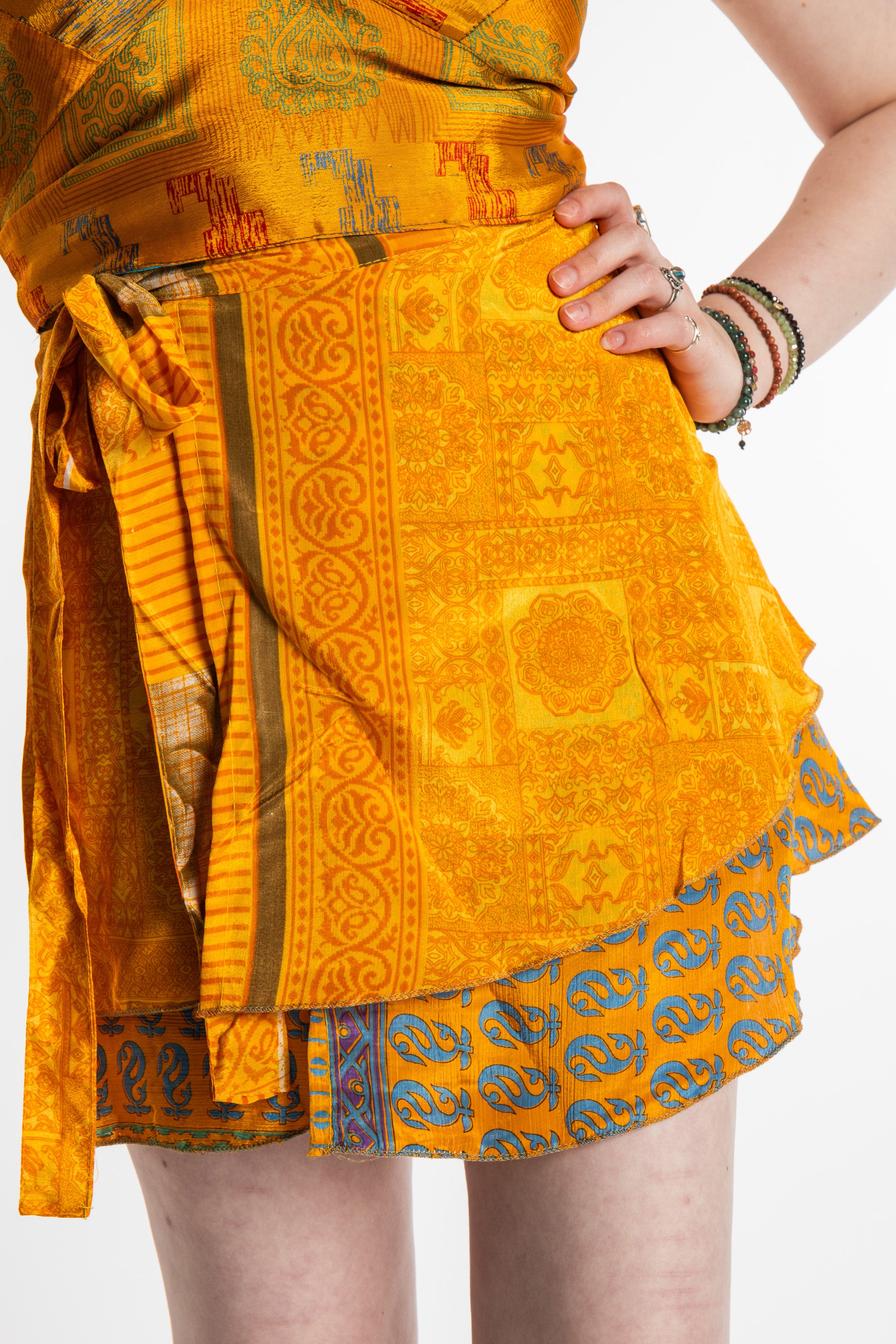 Honora is wearing a silk wrap skirt in Fire on the Mountain