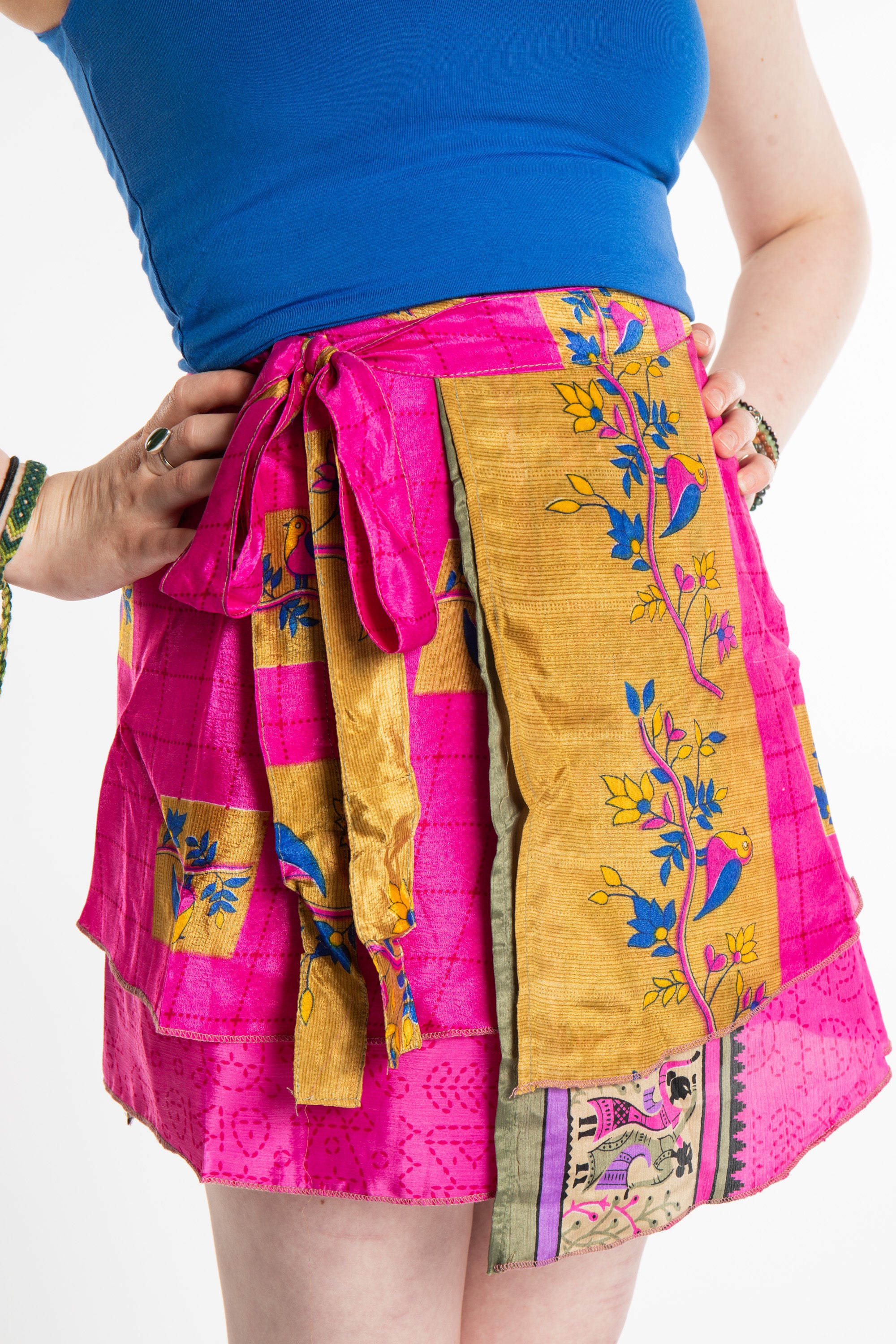 Honora is wearing a silk wrap skirt in sugar magnolia