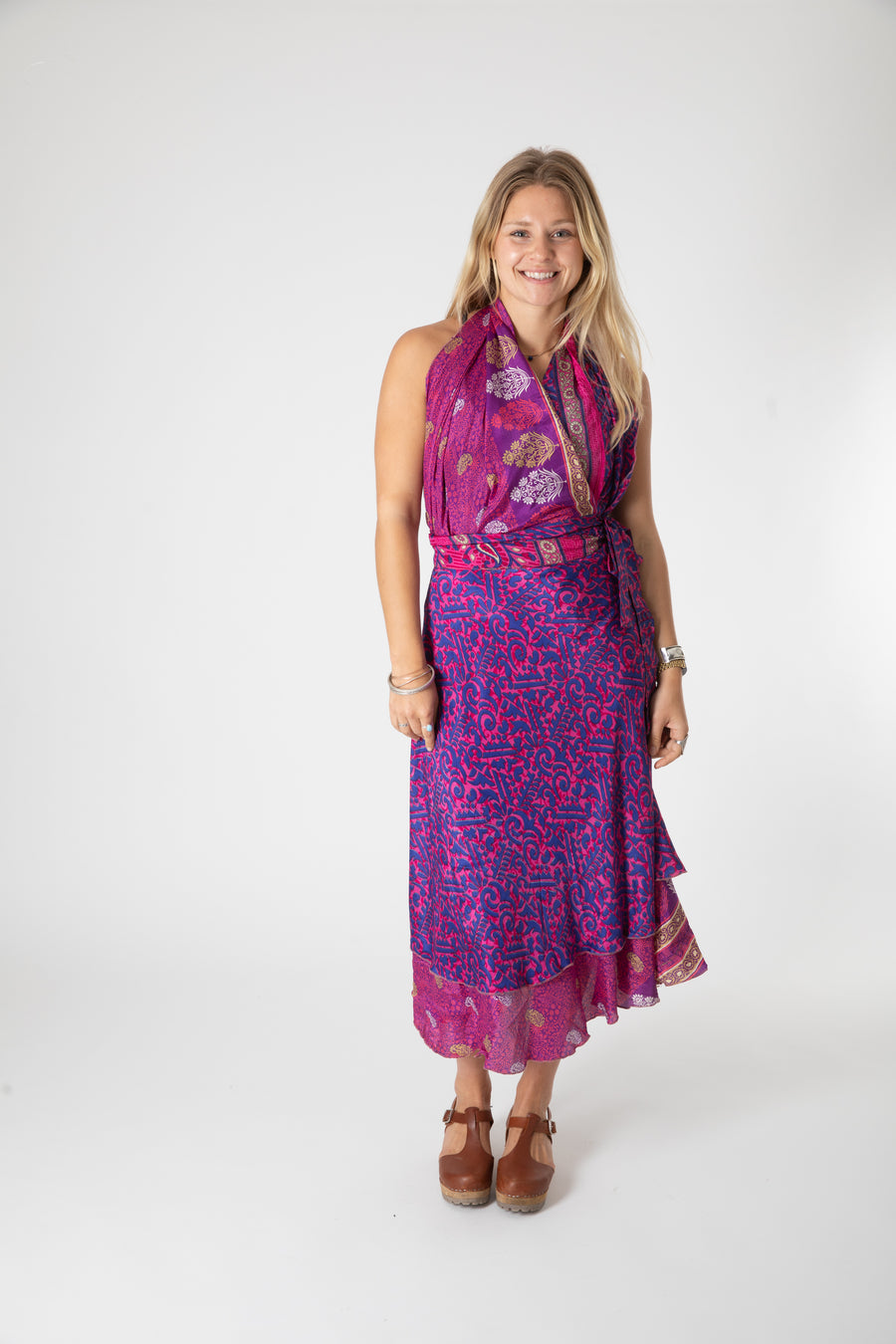 Beautiful blonde hippie girl wearing a recycled silk magic skirt as a boho hippie style silk wrap dress