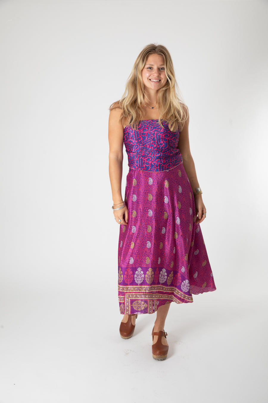 Beautiful blonde hippie girl wearing a recycled silk magic skirt as a boho hippie style silk wrap dress