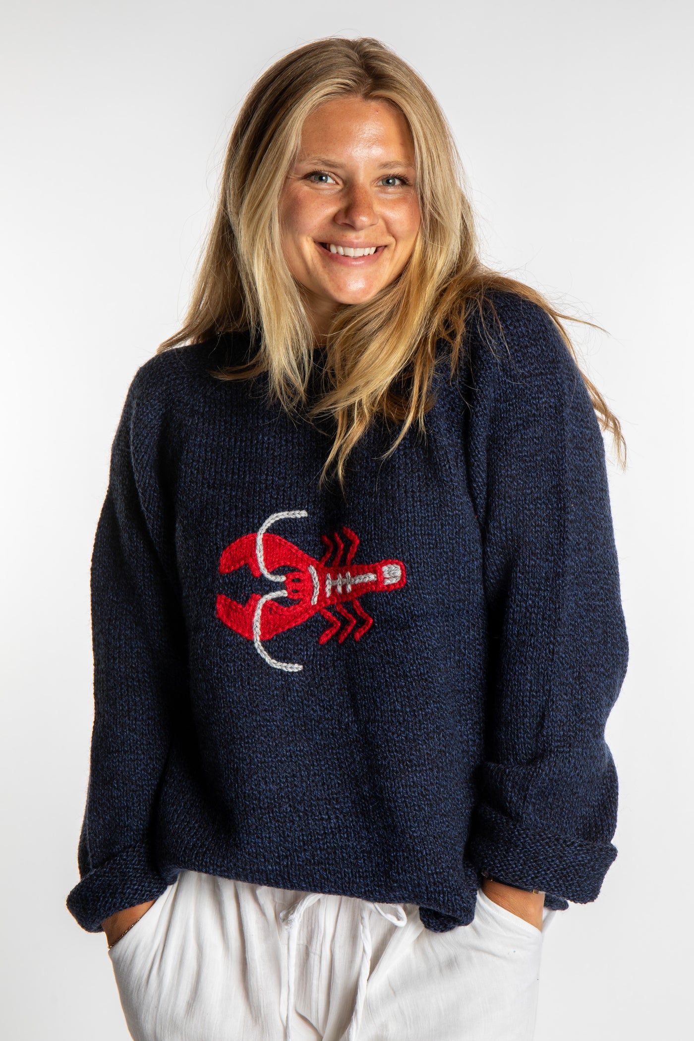 Sophie is wearing a size S Navy Lobster Sweater