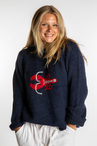 Sophie is wearing a size S Navy Lobster Sweater