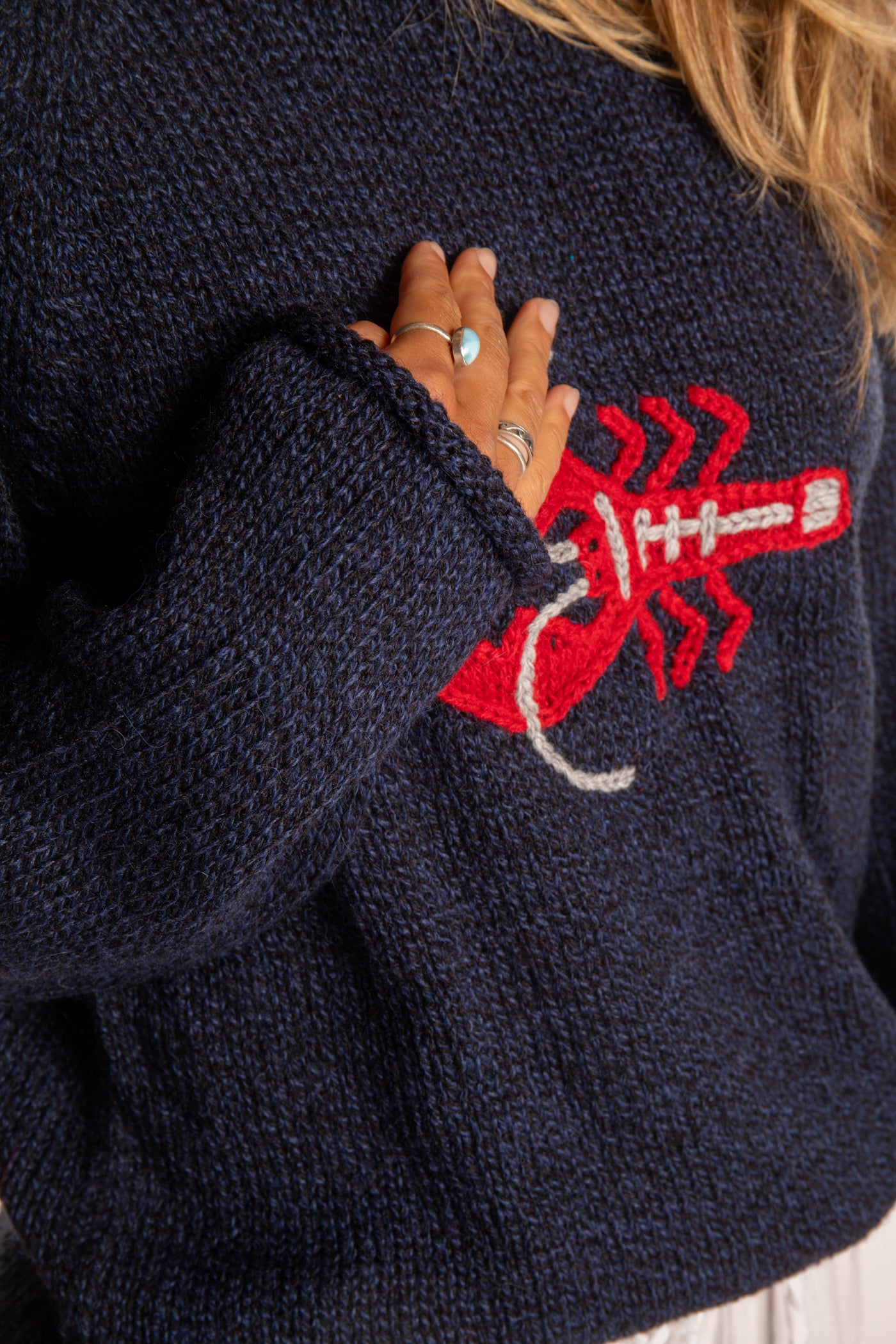 Sophie is wearing a size S Navy Lobster Sweater