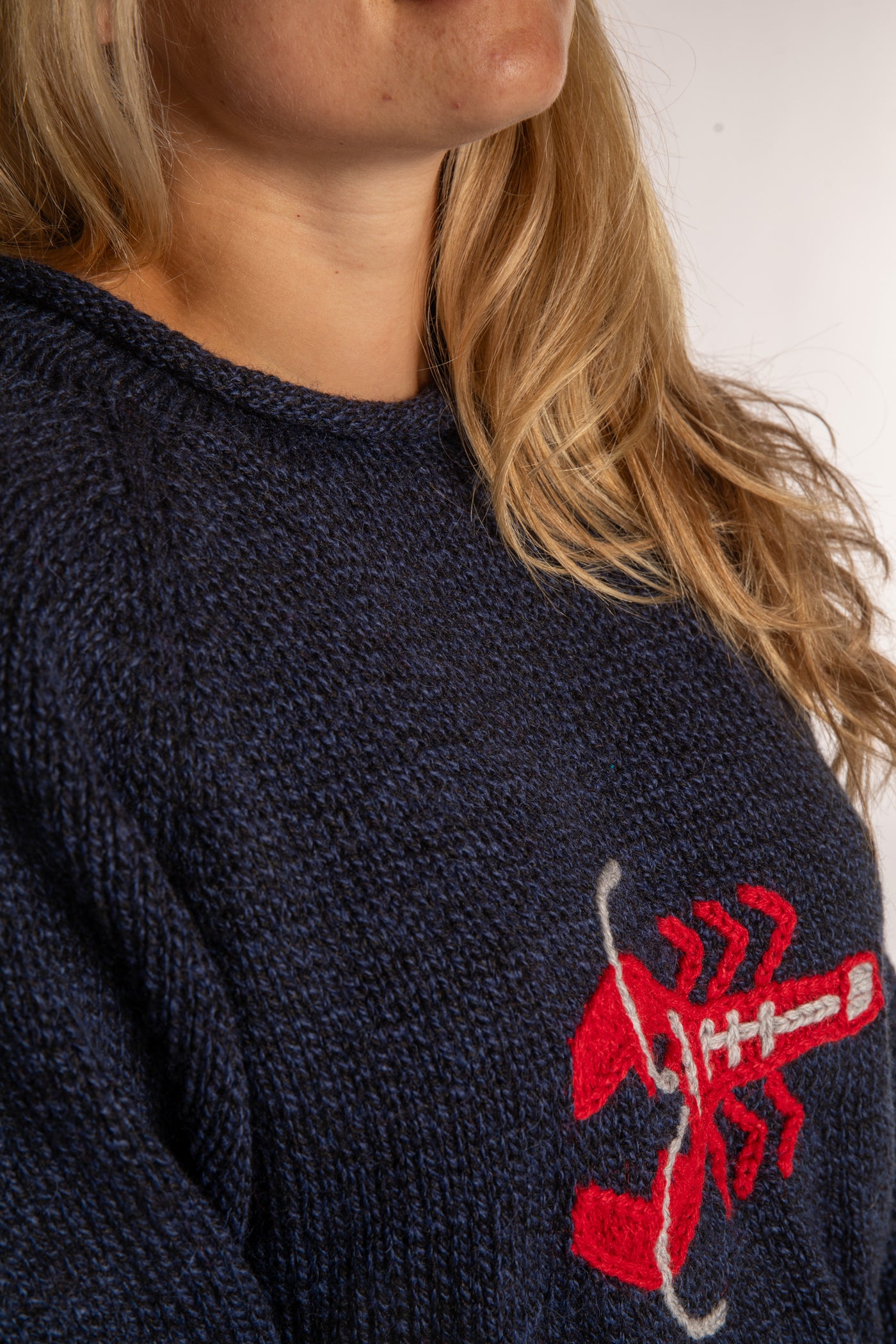 Sophie is wearing a size S Navy Lobster Sweater