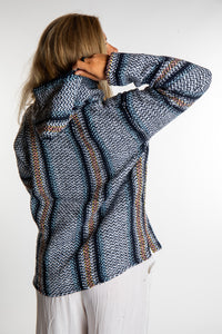 Sophie is wearing a small artesia recycled baja hoodie
