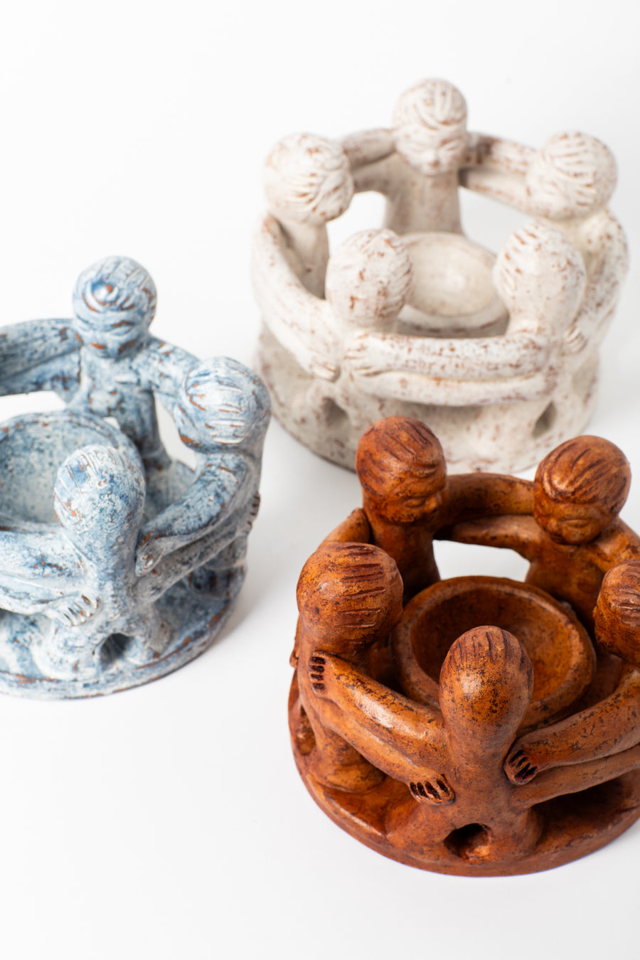 Circle of friends candleholders in white, blue, and brown