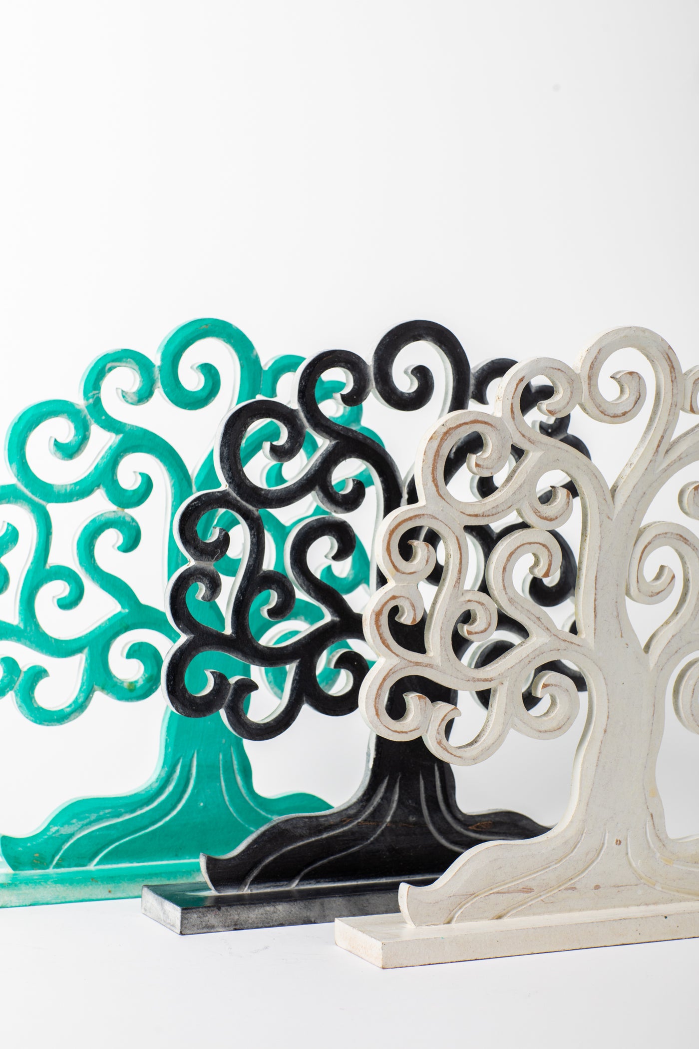 Wooden tree of life sculpture in turquoise, black, and white