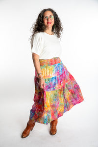 Susan wearing the white dolman top in m/l and the batik prairie skirt in cotton candy
