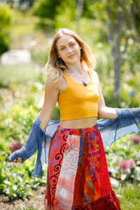 Woman in solid tank top in garden