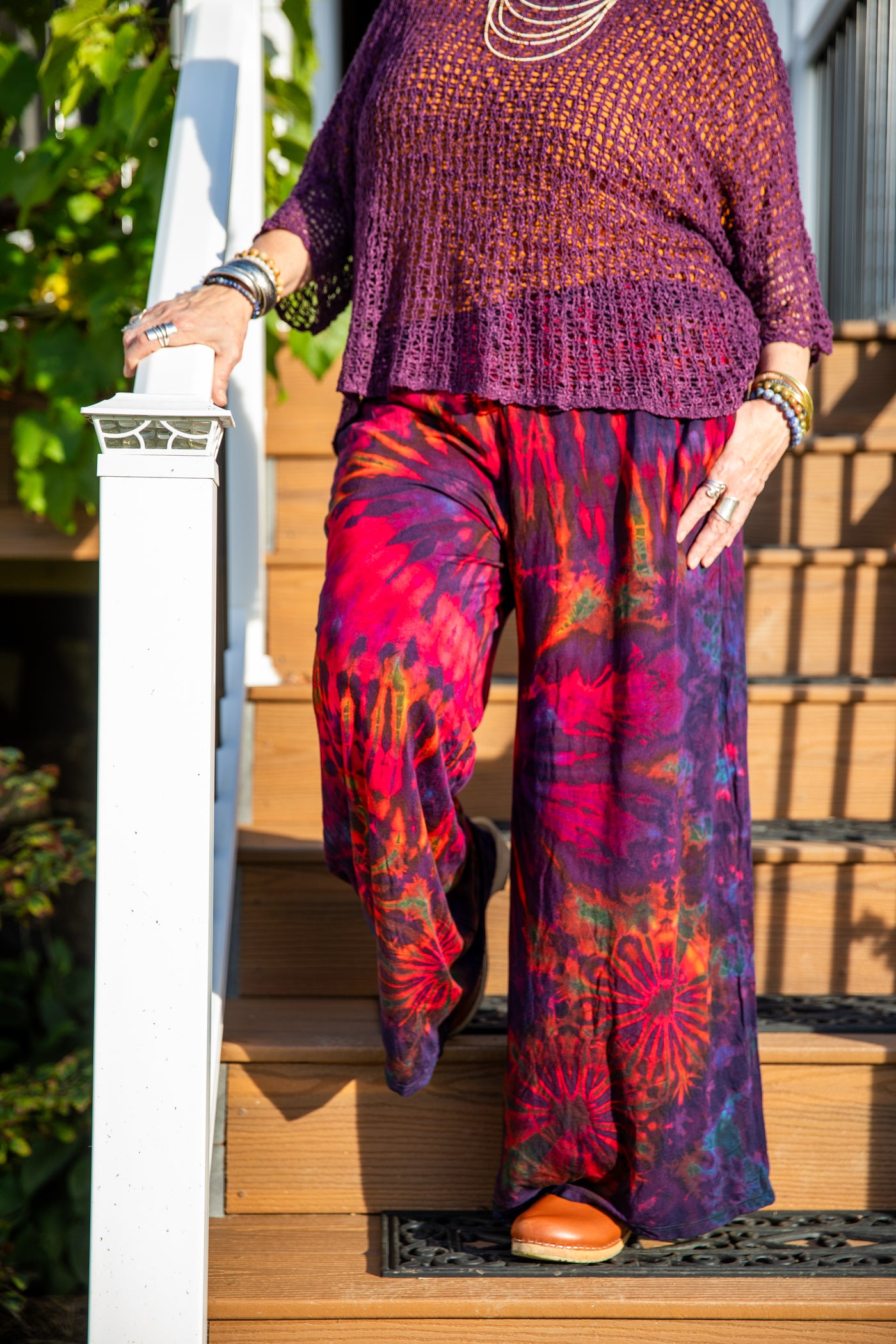 Betty is wearing the size M/L wide leg tie dye pants in eggplant
