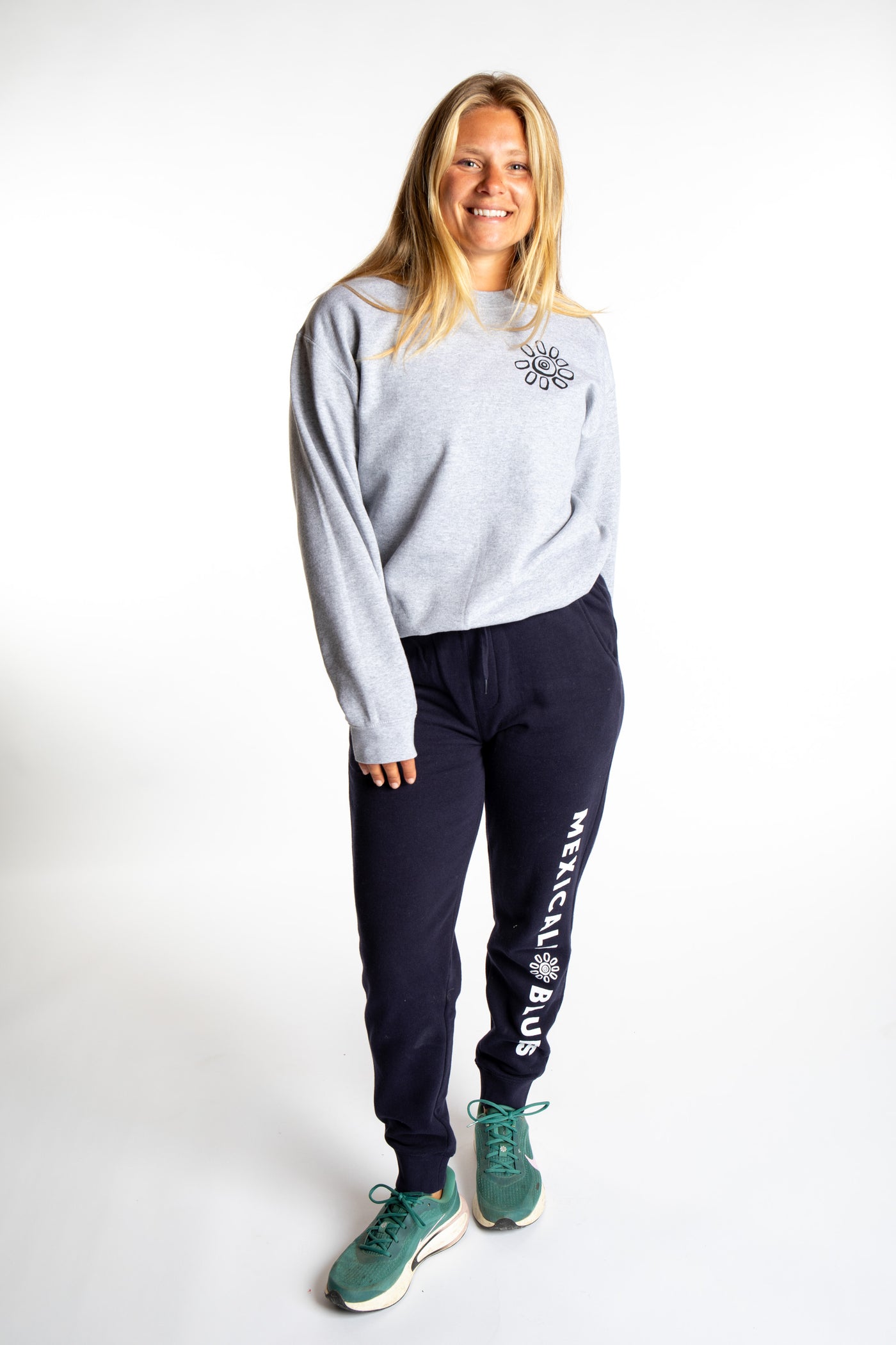 Sophie wearing a size S Heather Sport Gray branded crew neck with size S Navy Joggers