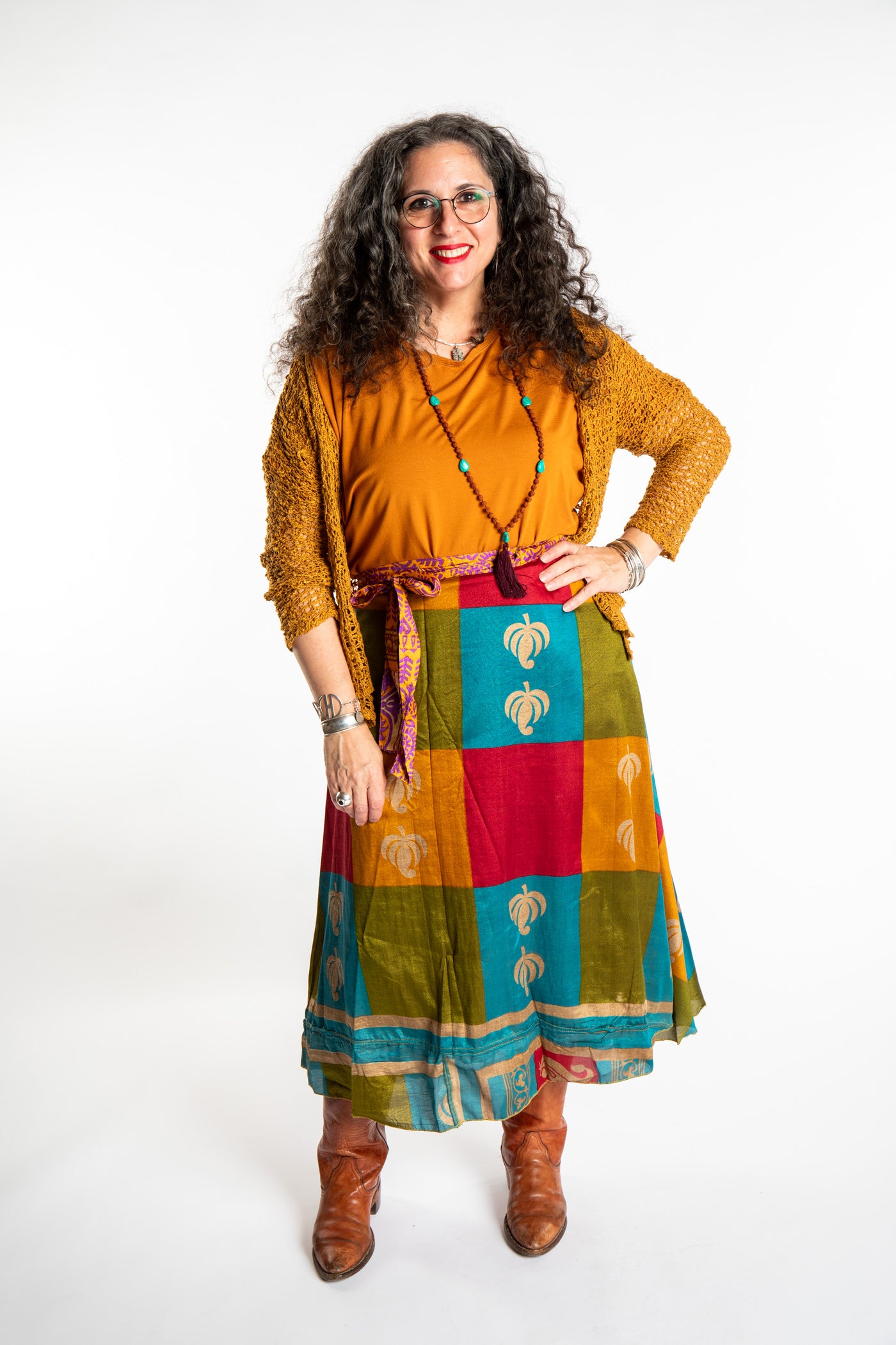 Susan wearing the dolman top in m/l, talia loose knit cardigan in ochre and long silk wrap skirt in Fire on the Mountain