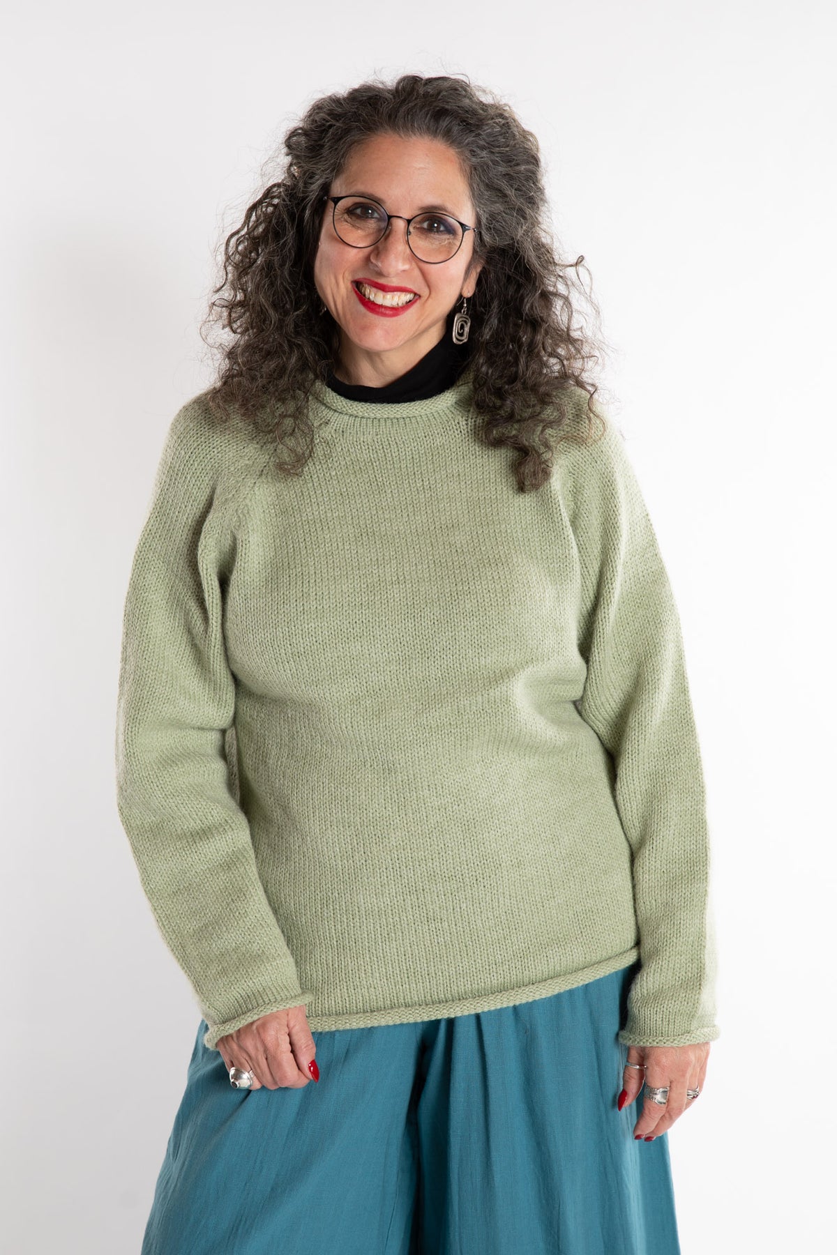 Susan is wearing a medium Classic Alpaca Wool Sweater in Celery