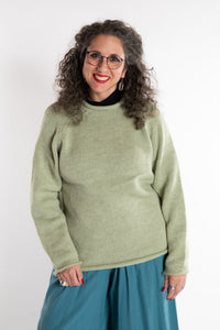 Susan is wearing a medium Classic Alpaca Wool Sweater in Celery