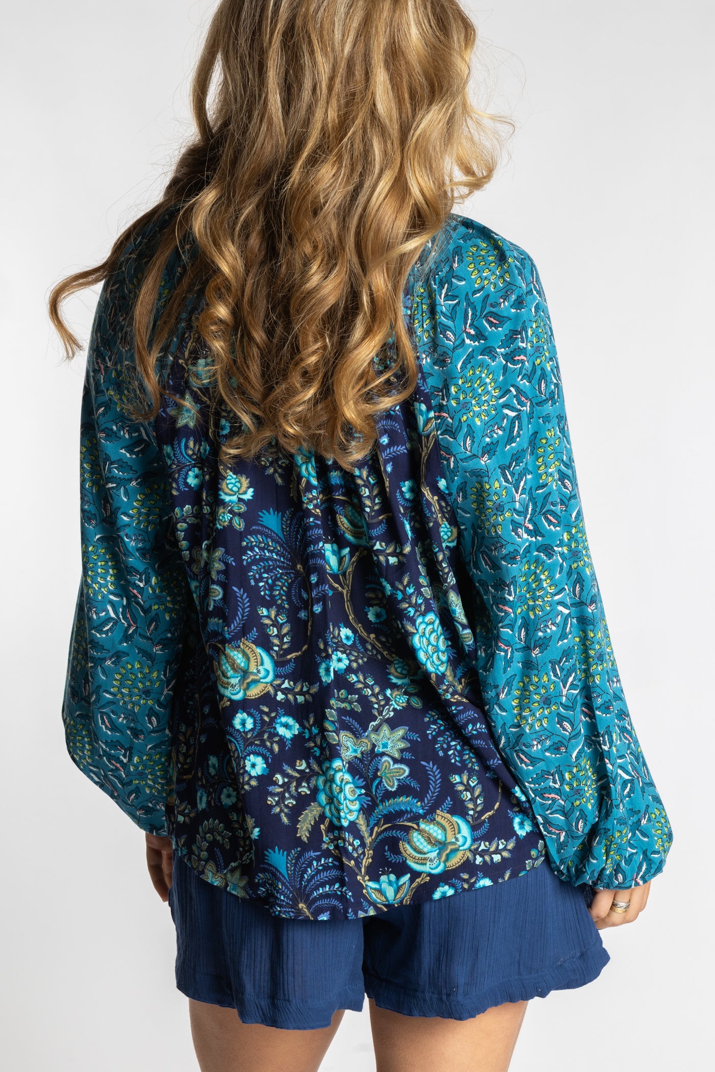 Sophie is wearing the mixed print navy boho floral poet blouse top
