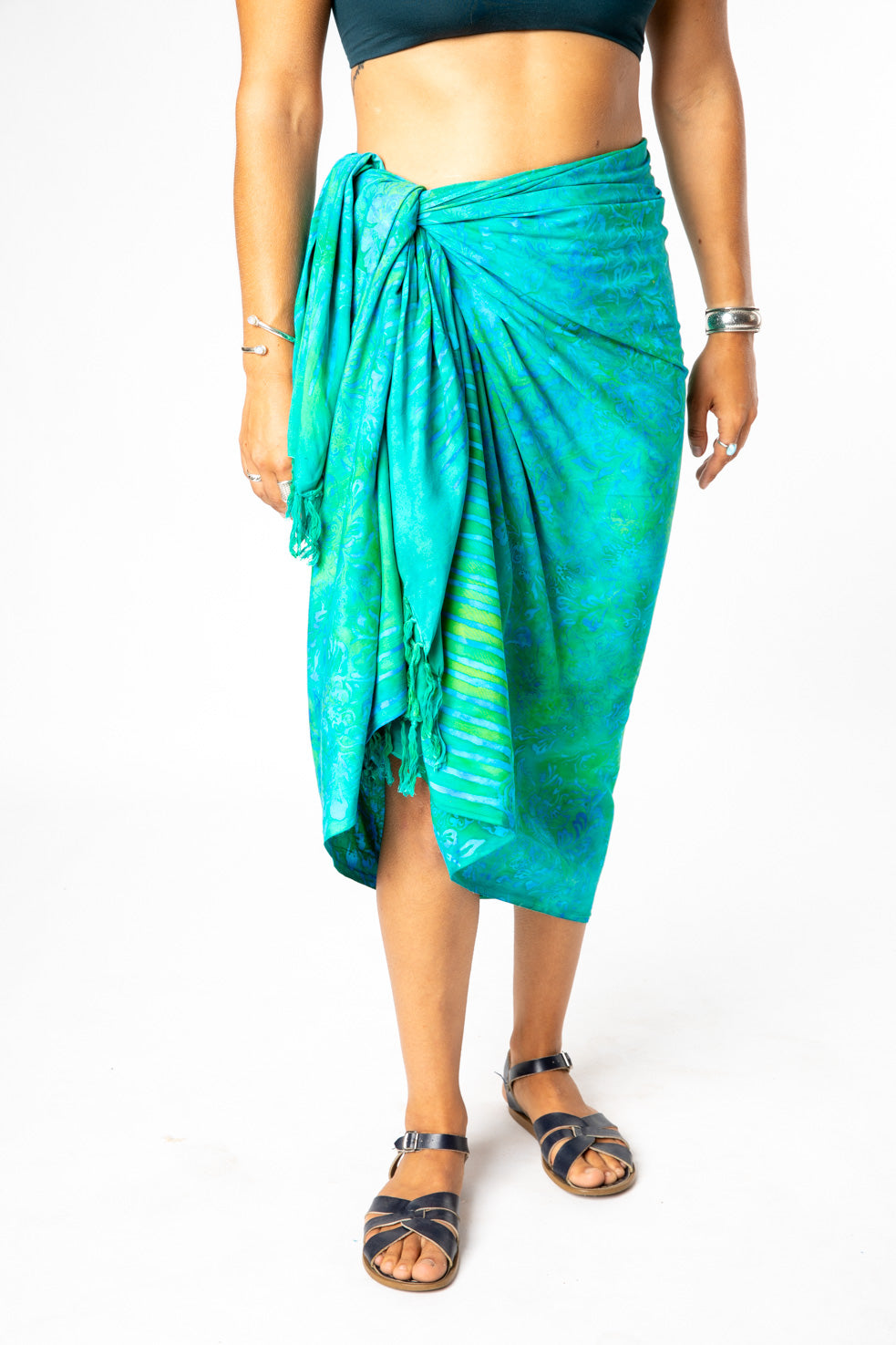 Sophie is wearing a batik sarong in blue green jungle 