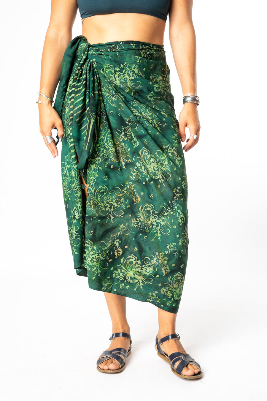 Sophie is wearing a batik sarong in green gardens