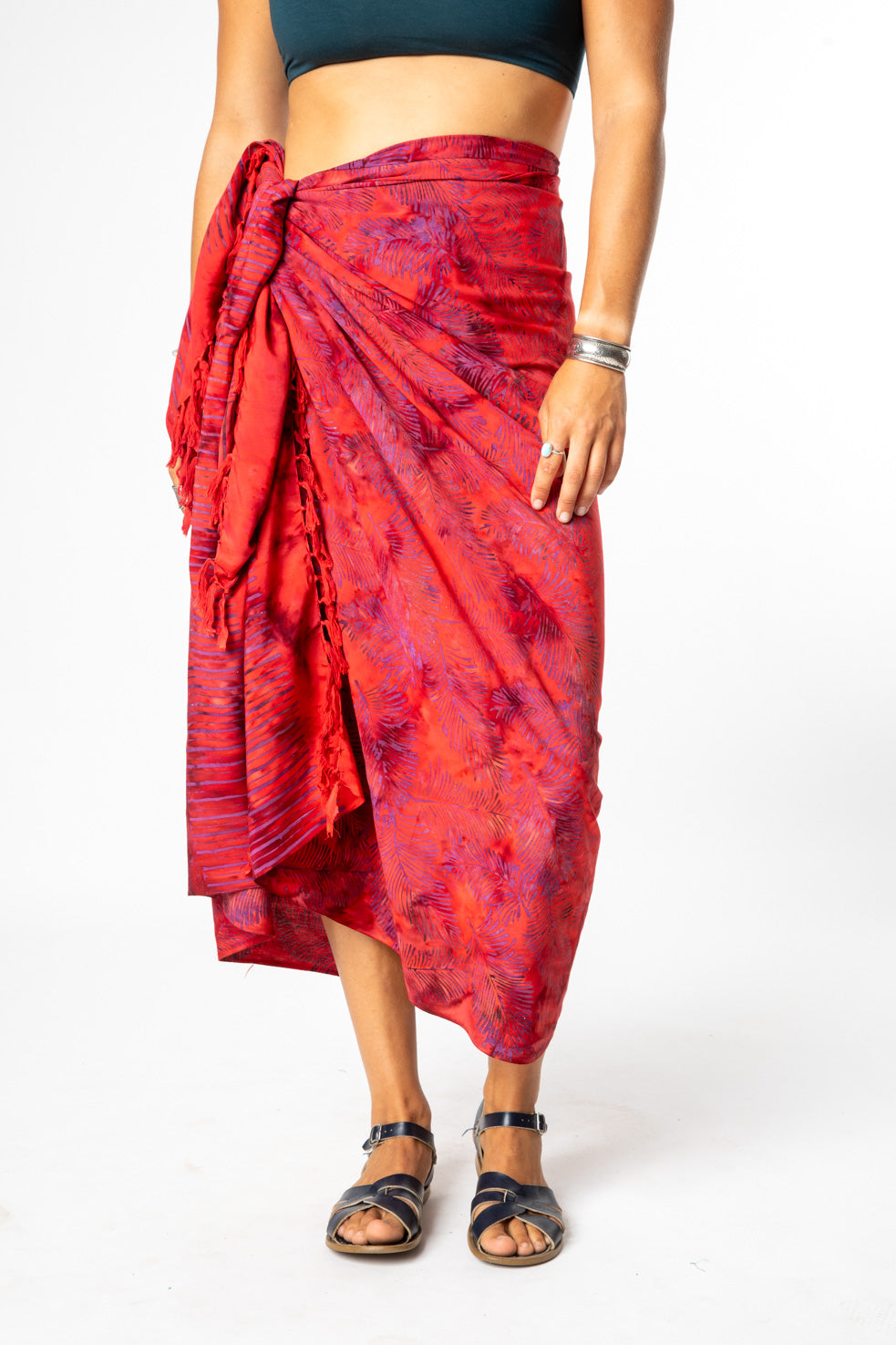Sophie is wearing a batik sarong in red feather