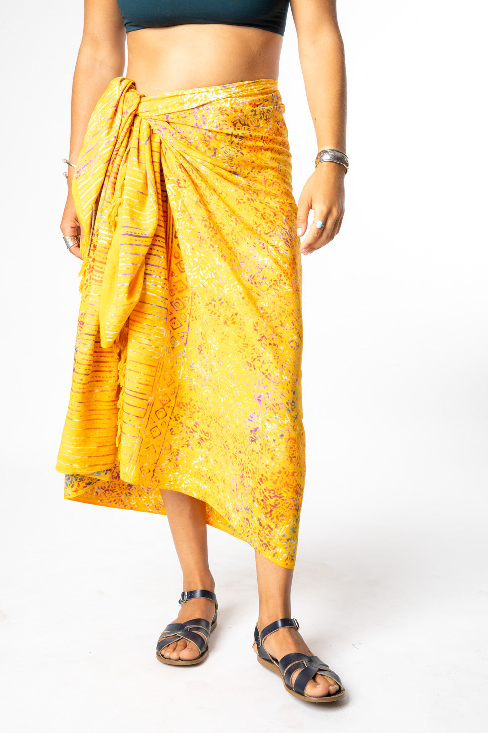 Sophie is wearing a batik sarong in sunlit shadows