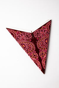 Alia Maroon embroidered paper star folded up, out of the package