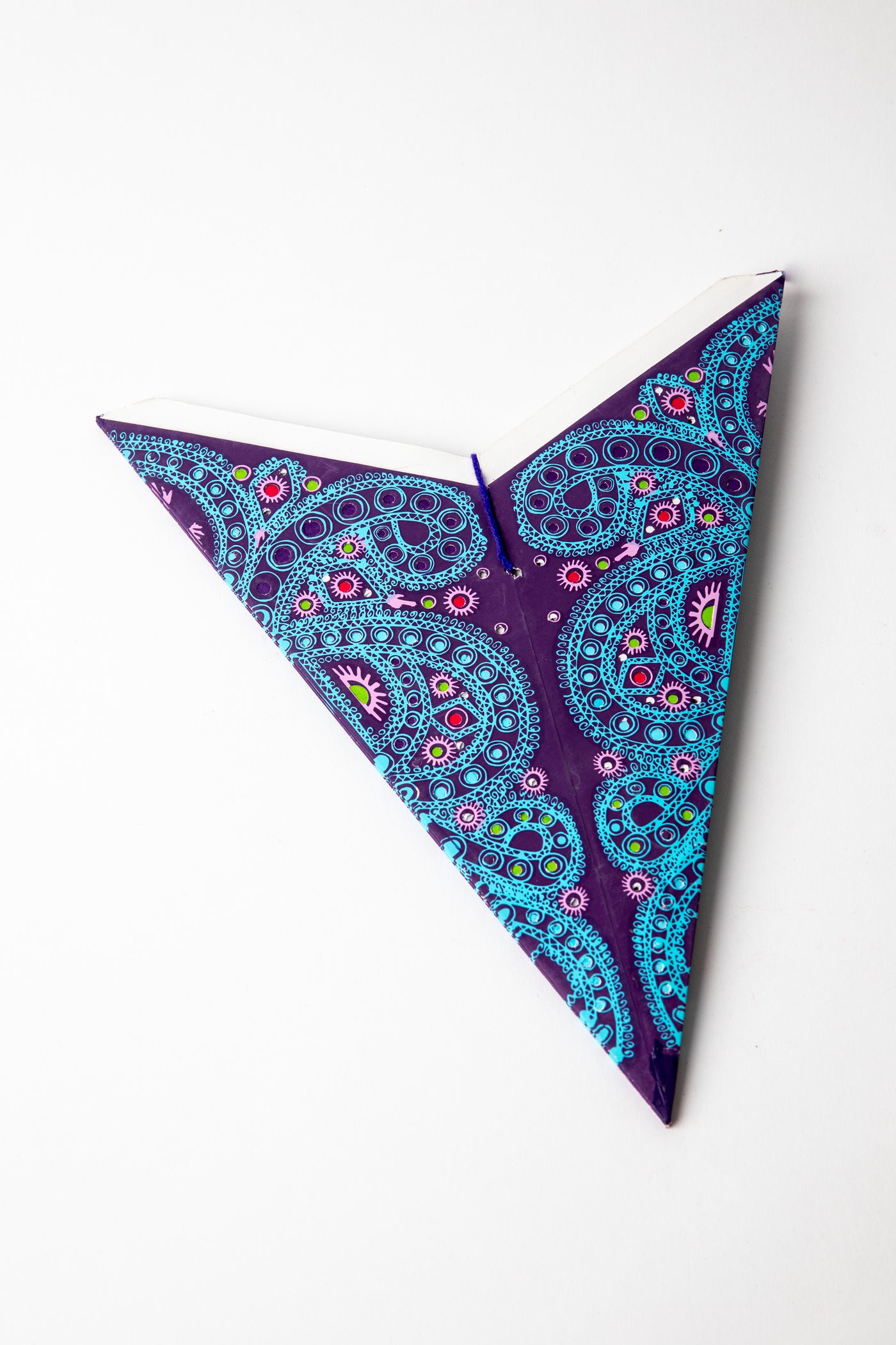 Alia Purple embroidered paper star folded up, out of the package