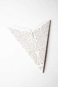 Ganesh White embroidered paper star folded up, out of the package