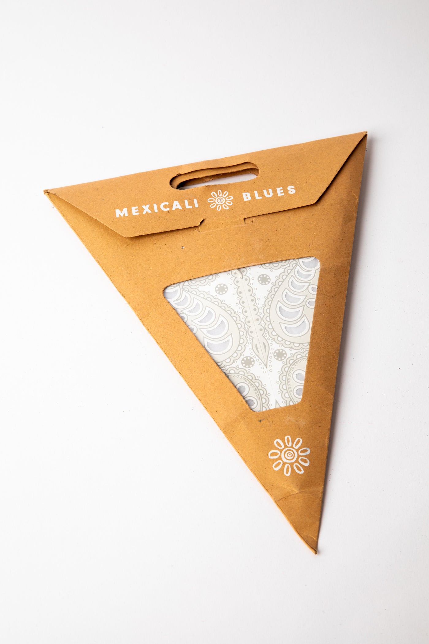 Ganesh White embroidered paper star, folded up, in packaging