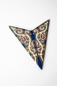 Hella Blue embroidered paper star folded up, out of the package