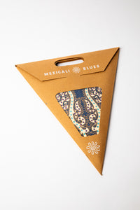 Hella Blue embroidered paper star, folded up, in packaging