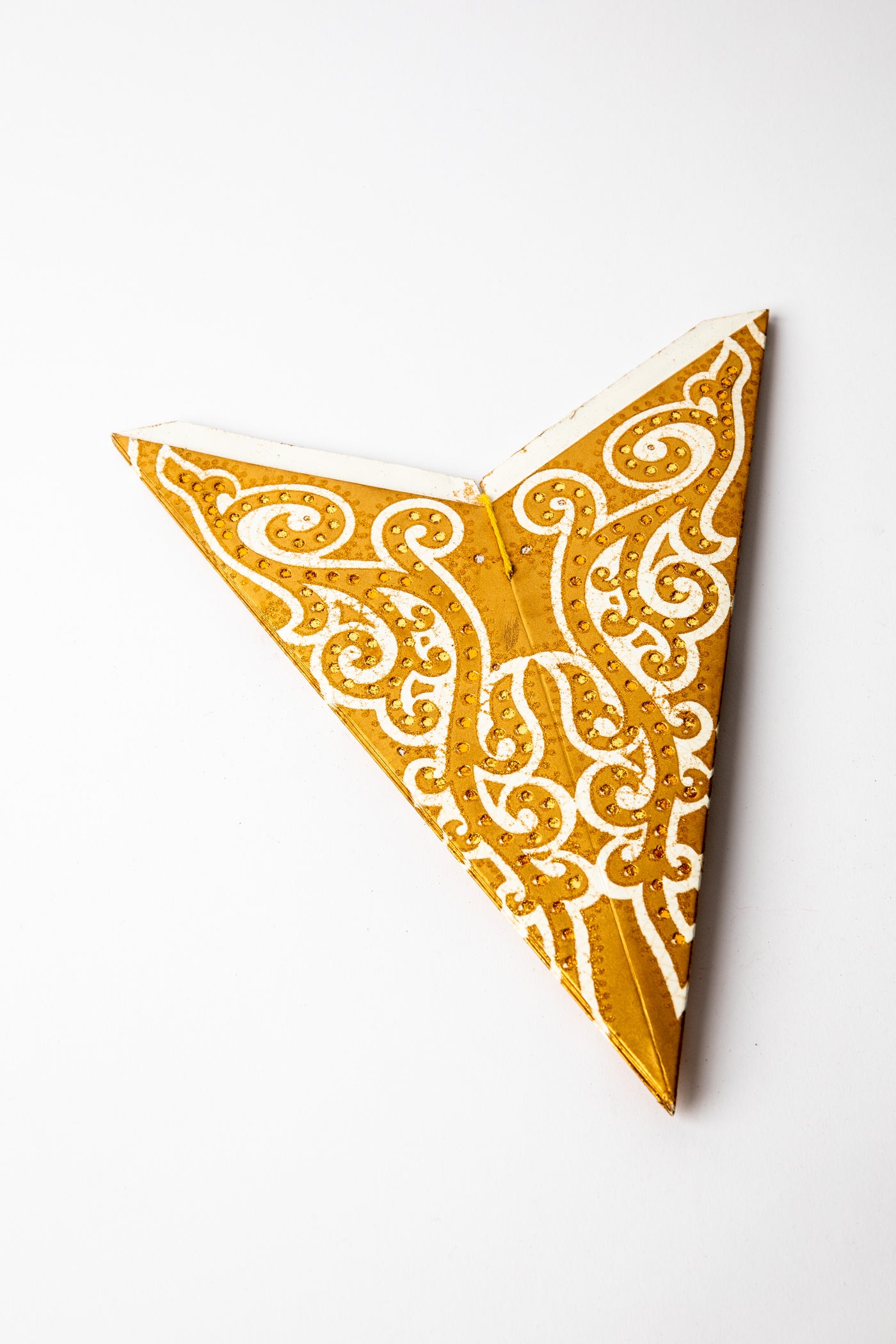 Hella Silver Copper Glitter embroidered paper star folded up, out of the package