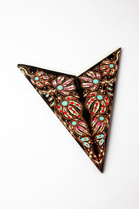 Mari Black embroidered paper star folded up, out of the package